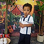 Adonis And Brayden joined the competition — help win amazing prizes! child, boy, portrait, indoor, traditional_clothing, sandals, plants, decorations, cactus, guitar, string_lights, carpet, pot_plants, colorful, curtains, fabric, floor, expression, standing, background