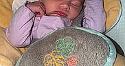 Blakely joined the competition — help win amazing prizes! baby, sleeping, infant, cozy, pillow, cushion, clothing, sock, seat, child, cute, peaceful, indoors, resting, soft, young, portrait, relaxed, head, face