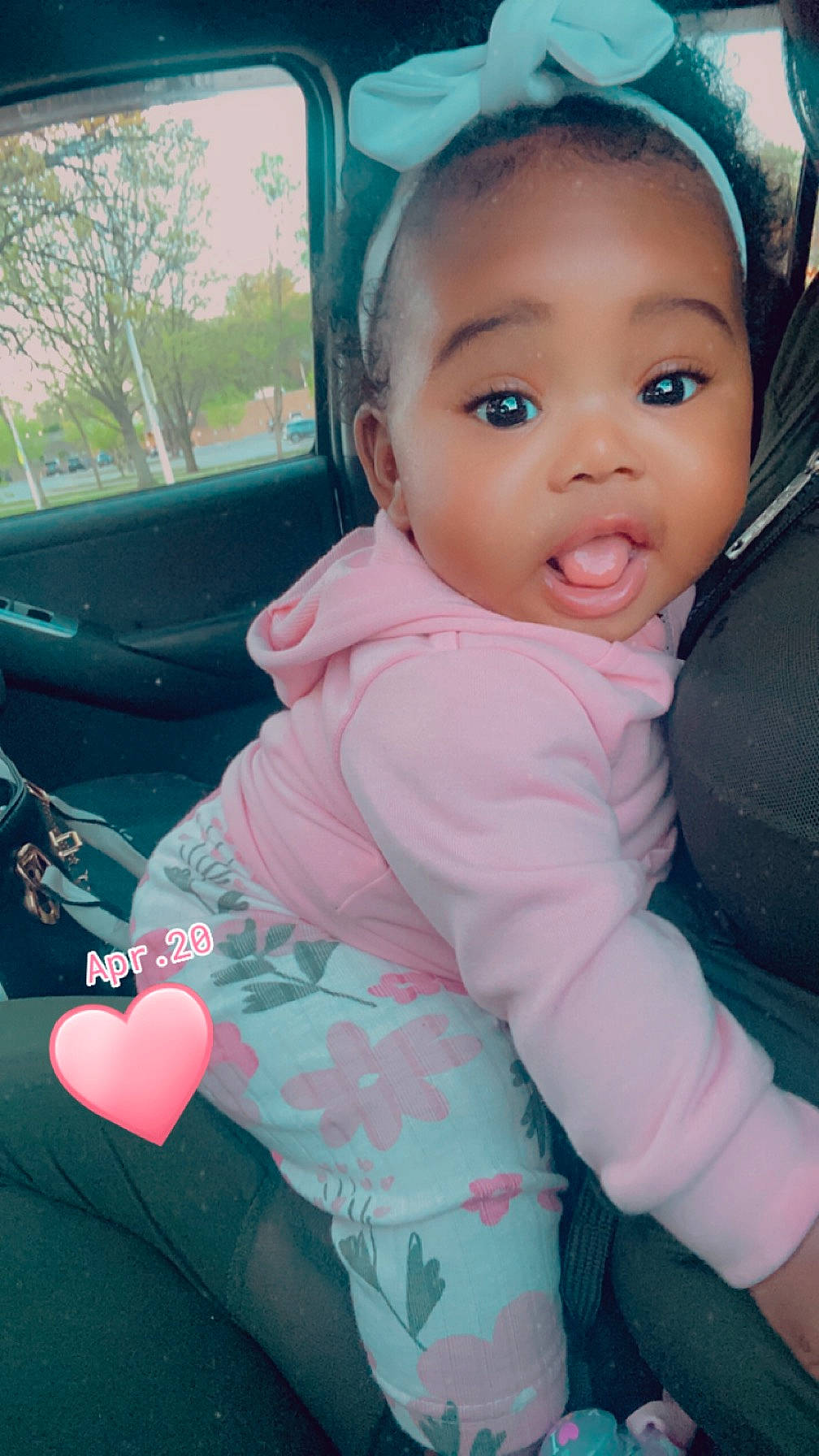 Lariah joined the competition — help win amazing prizes! arm, auto_part, baby_toddler_clothing, car, car_seat, child, eye, face, finger, happy, head, lip, magenta, motor_vehicle, person, pink, steering_wheel, surprise, toddler, tree