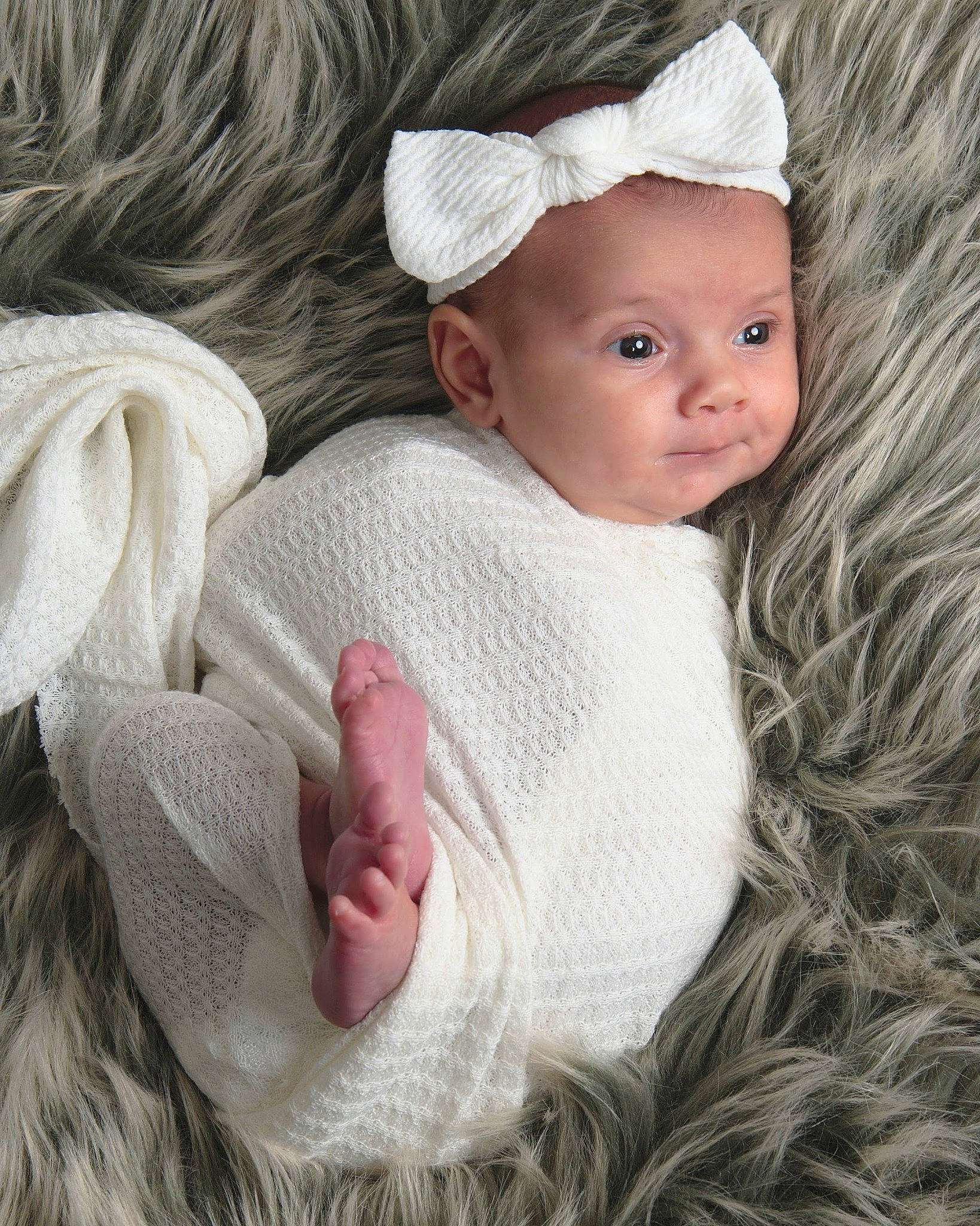 Melody is registered to the contest to win money with this photo: baby, baby_toddler_clothing, cap, cheek, child, eye, fashion_accessory, fur, gesture, happy, human_body, knit_cap, lip, outerwear, person, pink, skin, sleeve, textile, toddler