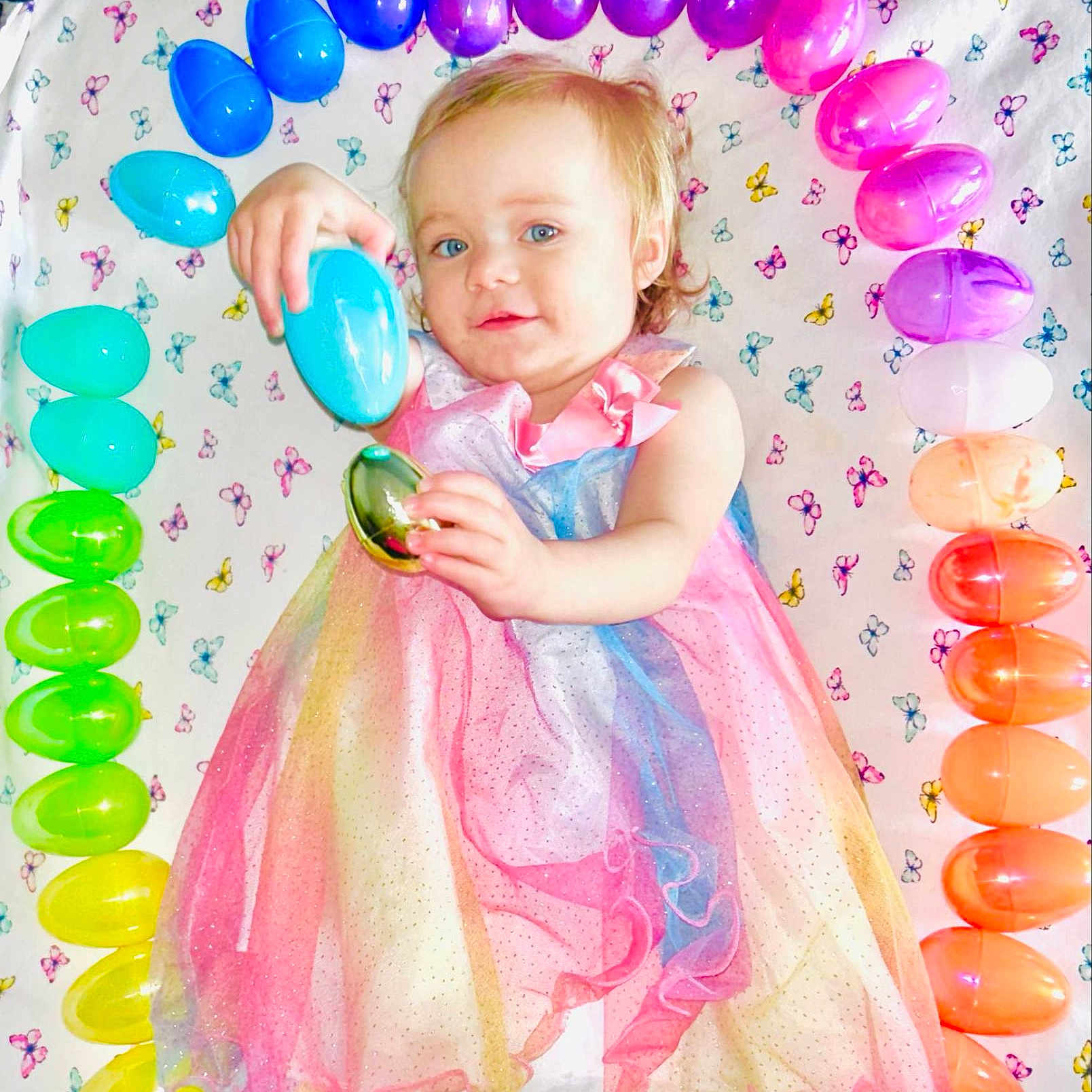 Sophie is registered to the contest to win money with this photo: baby, balloon, clothing, dress, egg, face, food, fun, happy, head, party, people, person, photobooth, photography, portrait, purple, sleeve, smile, sweets