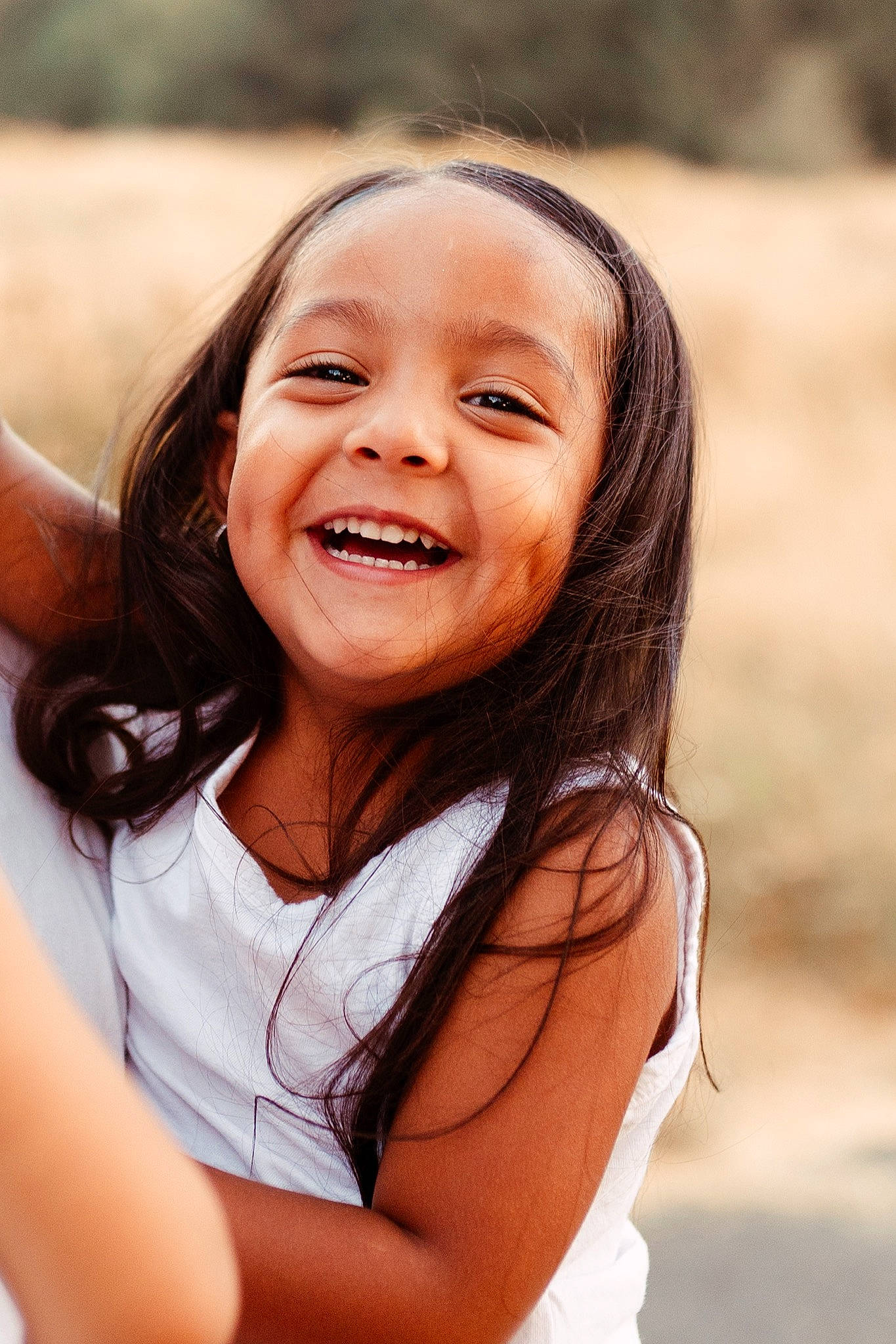 Milani joined the competition — help win amazing prizes! cheek, chin, close_up, flash_photography, fun, gesture, grass, hair, happy, iris, joy, leisure, lip, long_hair, nose, people_in_nature, person, plant, shoulder, skin