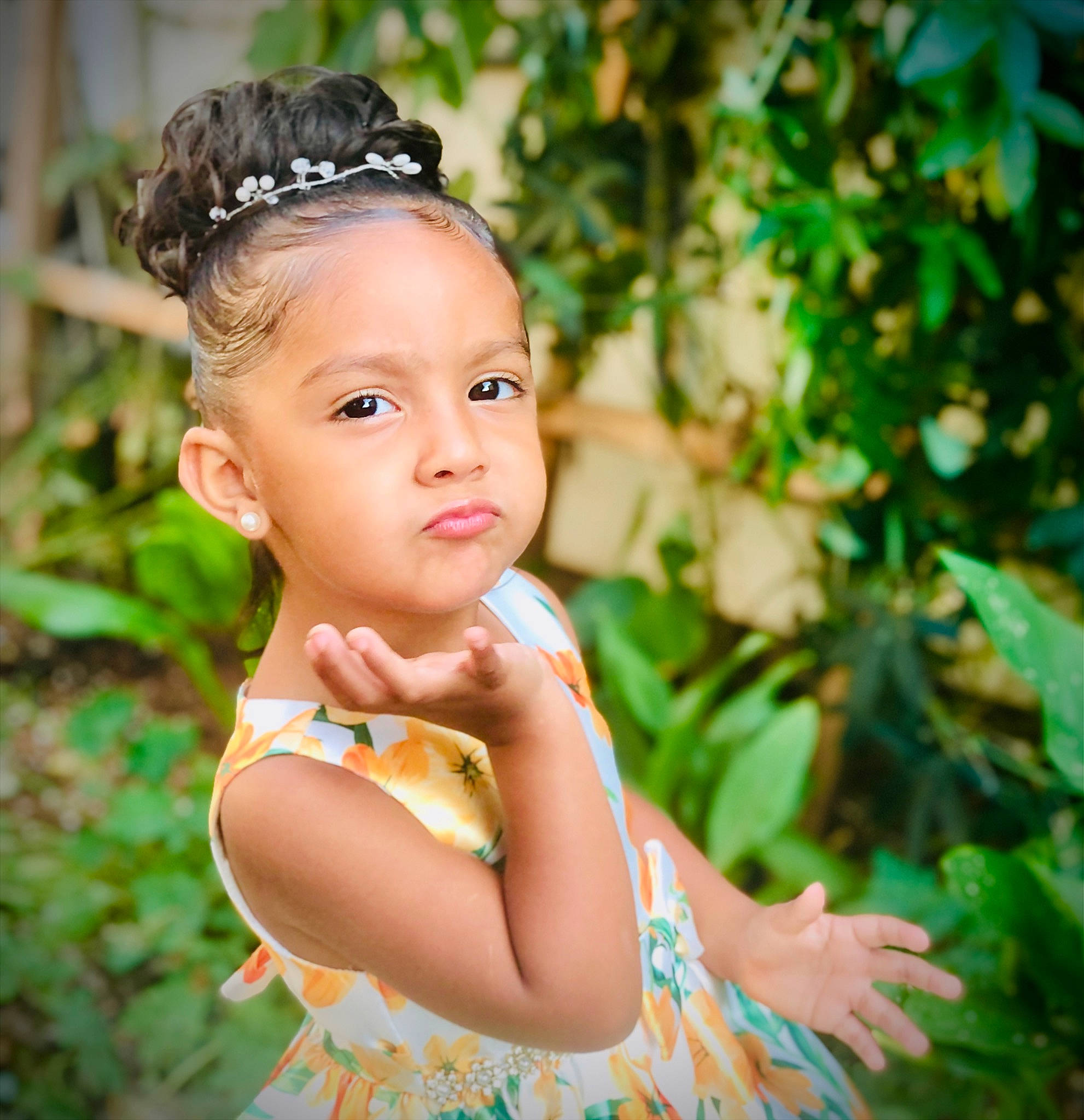 Milani is registered to the contest to win money with this photo: baby_toddler_clothing, brown_hair, child, day_dress, eyelash, fashion_accessory, flash_photography, grass, hair_accessory, happy, headband, headpiece, iris, jewellery, leaf, people_in_nature, person, plant, portrait, portrait_photography