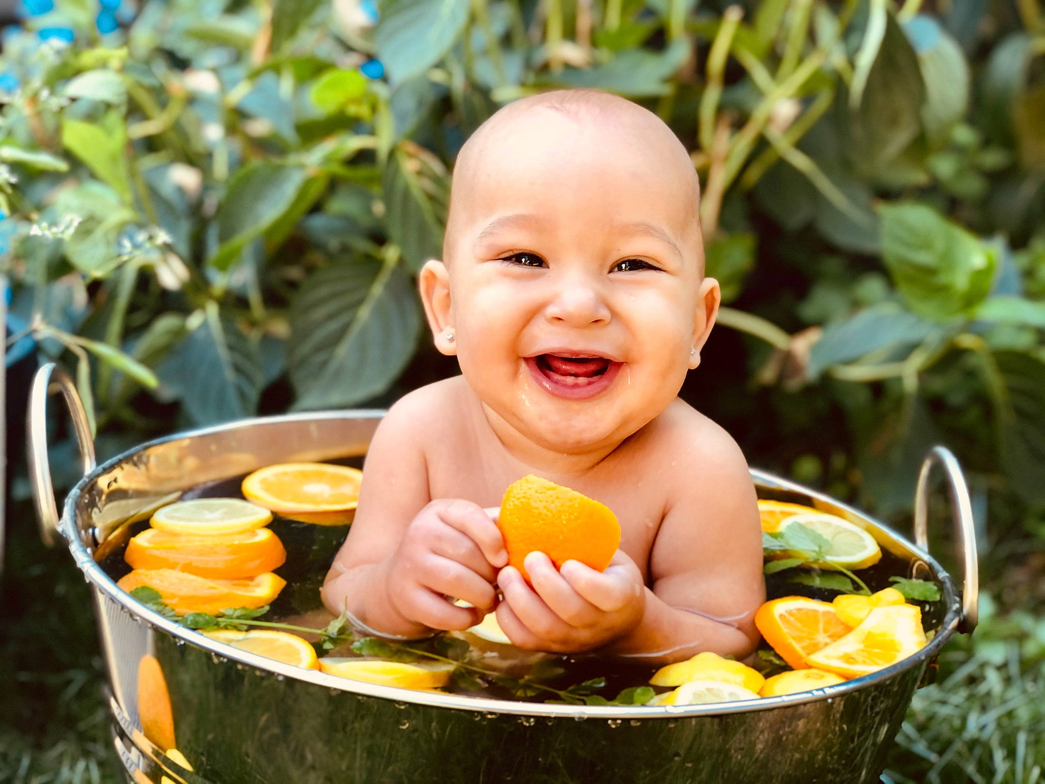 Princeton is registered to the contest to win money with this photo: baby, baby_toddler_clothing, child, cuisine, eye, finger, fruit, fun, grass, hand, happy, joy, leaf, leisure, natural_foods, people_in_nature, person, plant, sitting, smile