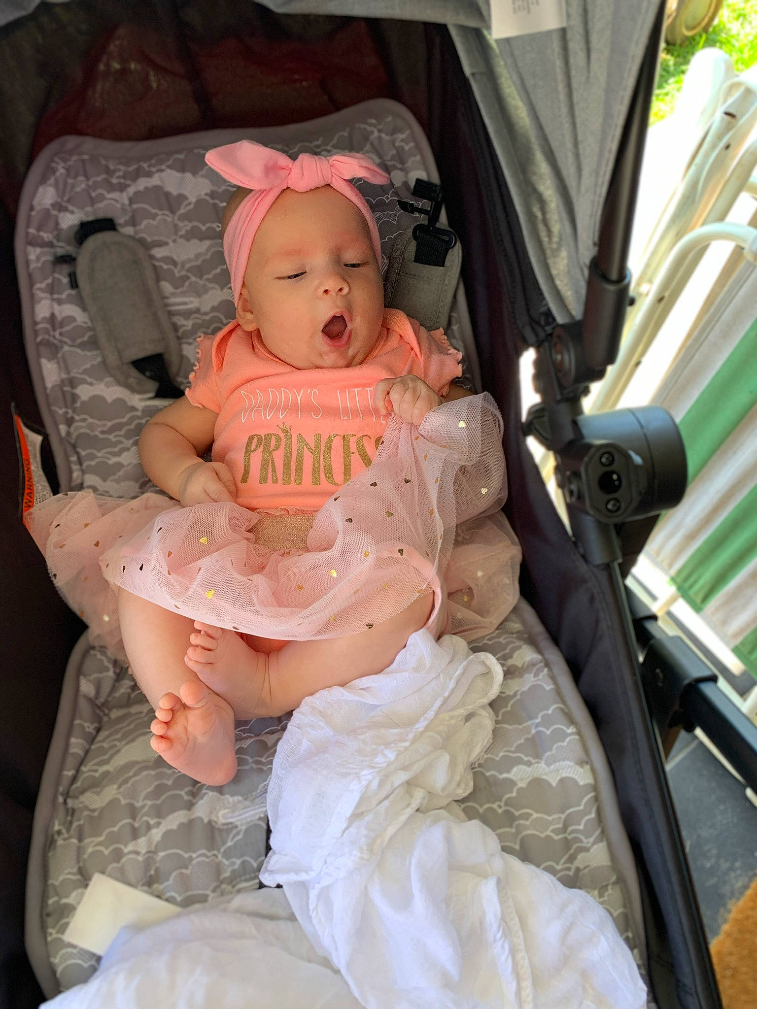 Elliannah is registered to the contest to win money with this photo: baby, baby_carriage, baby_products, car_seat, child, headwear, person, pink, product, sitting, toddler