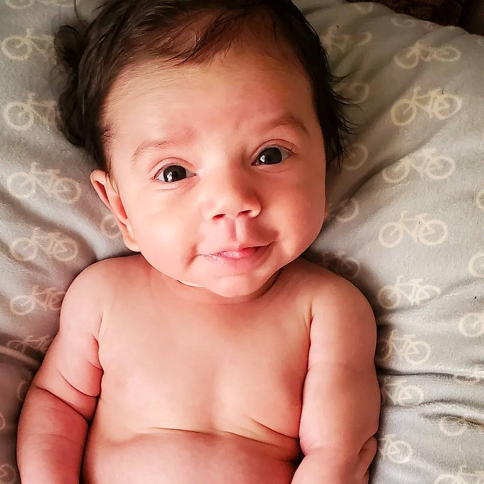 Jared is registered to the contest to win money with this photo: arm, baby, cheek, chin, eye, eyebrow, eyelash, face, forehead, gesture, hair, hand, head, iris, jaw, lip, mouth, neck, nose, person