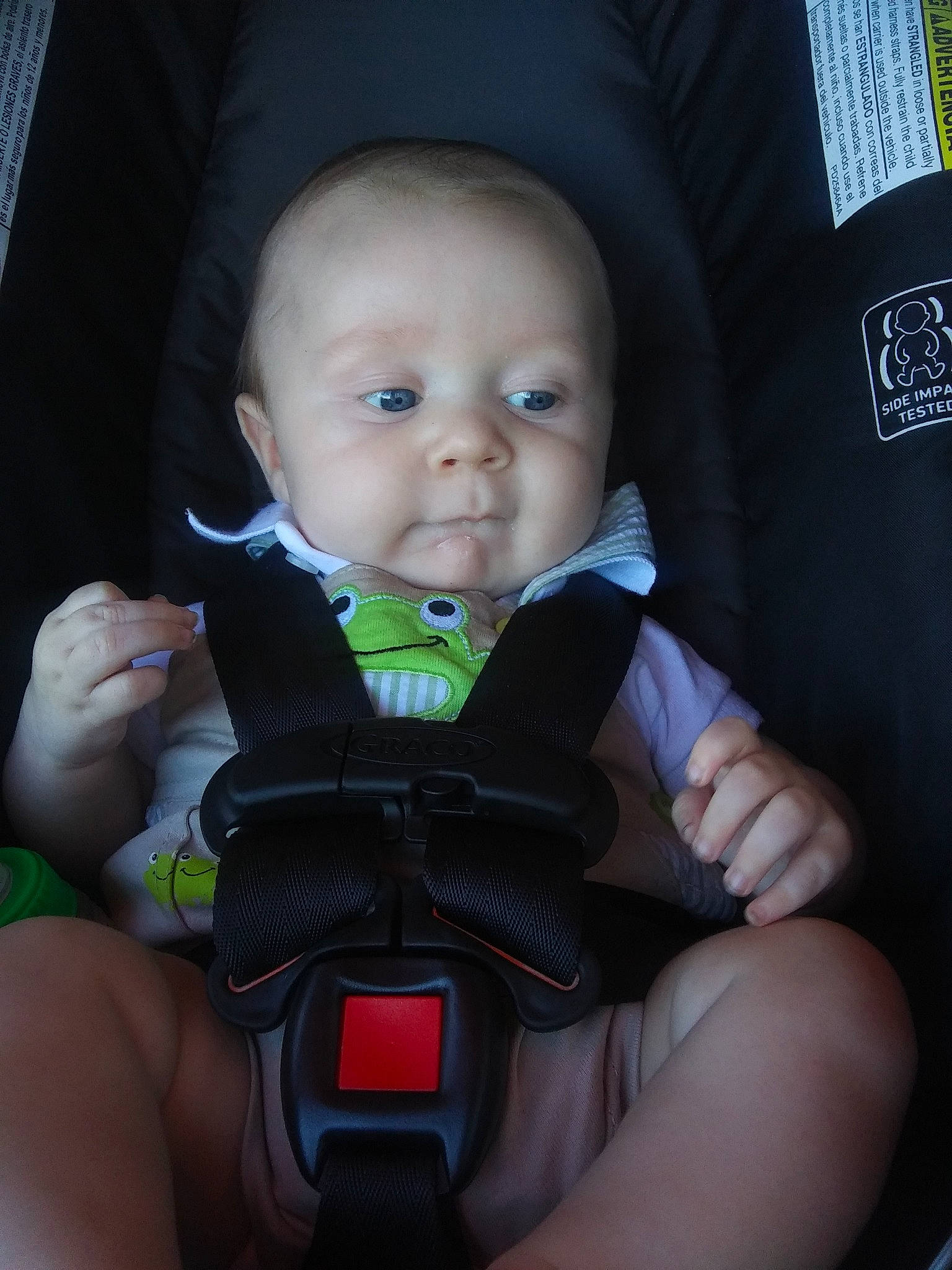 Tucker is registered to the contest to win money with this photo: auto_part, baby, baby_carriage, baby_in_car_seat, baby_products, car_seat, cheek, child, comfort, head, person, product, seat_belt, toddler
