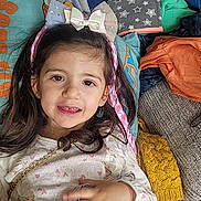 Zelya a rejoint le concours — aidez-le/la à gagner de superbes lots ! child, girl, smile, hair_bow, pink_hair_extensions, food, pillow, blanket, clothing, sitting, indoors, happy, cute, tutu_skirt, long_hair, face, hand, cozy, colorful, portrait