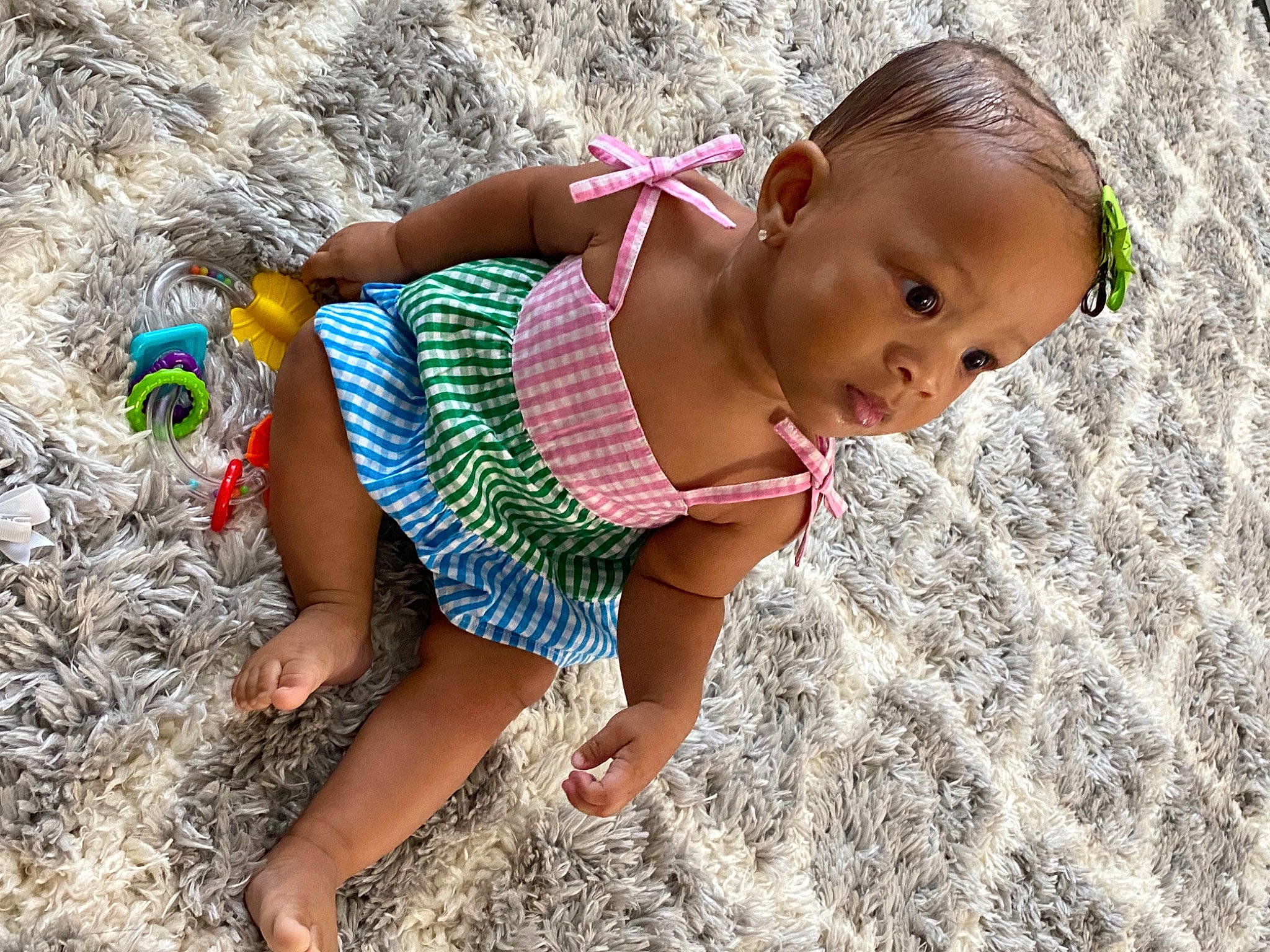 Mina is registered to the contest to win money with this photo: baby, baby_toddler_clothing, barefoot, child, foot, mouth, nose, people_in_nature, person, slipper, summer, toddler, toe