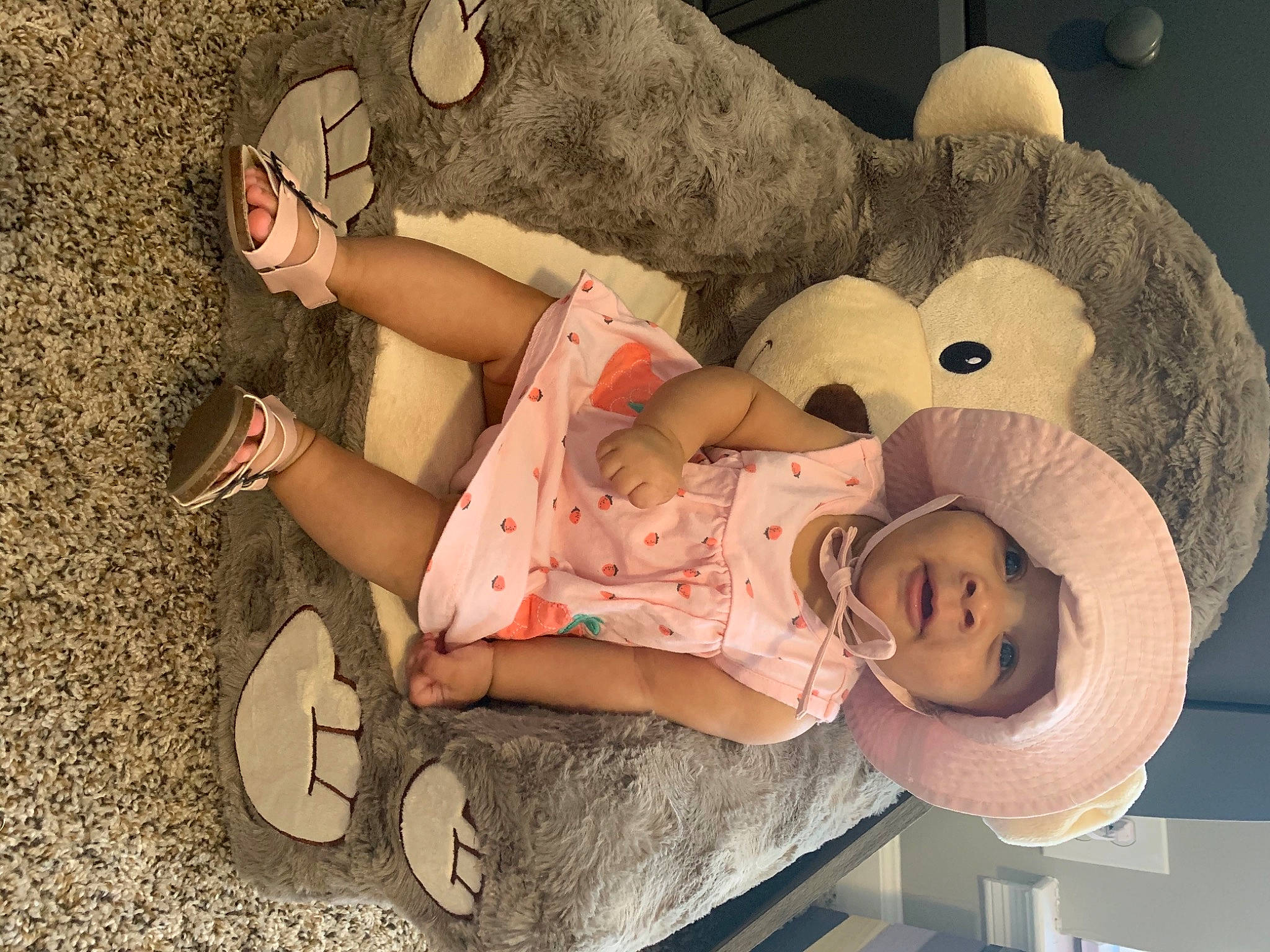 Mina is registered to the contest to win money with this photo: baby, baby_products, baby_toddler_clothing, baby_toys, bear, comfort, foot, headwear, human, person, plush, sandal, stuffed_toy, teddy_bear, toddler, toy