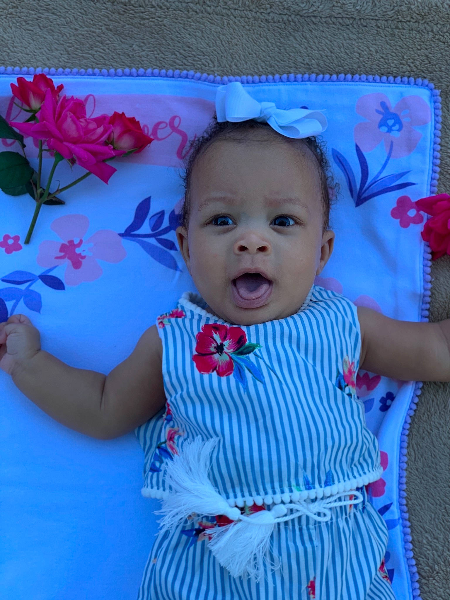 Mina is registered to the contest to win money with this photo: baby, baby_products, baby_toddler_clothing, blue, cheek, child, creative_arts, day_dress, dress, embellishment, one_piece_garment, pattern, pedicel, person, petal, pink, polka_dot, rose, textile, toddler