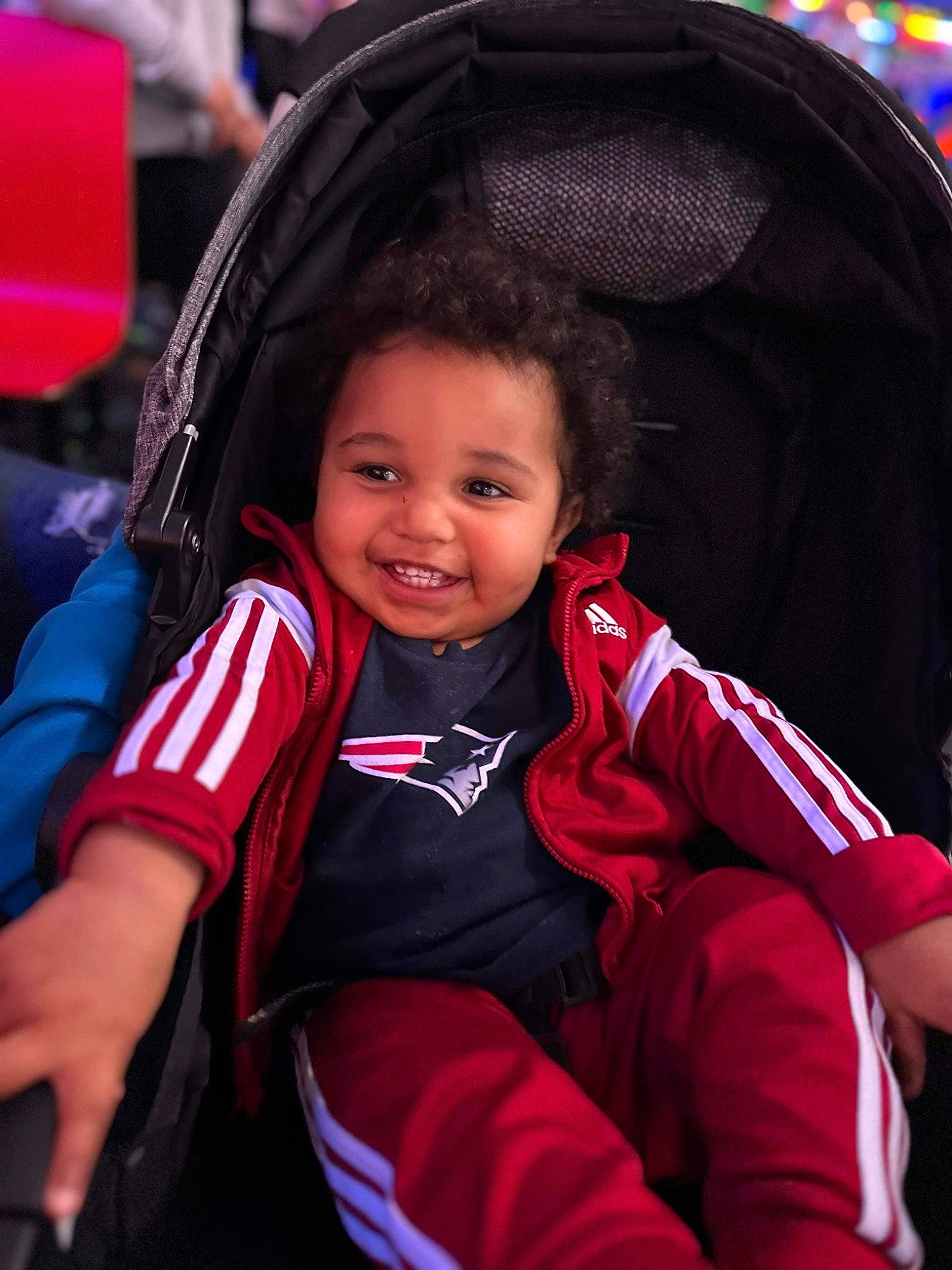 Amari joined the competition — help win amazing prizes! auto_part, automotive_design, baby_carriage, child, comfort, electric_blue, fashion_accessory, flash_photography, fun, happy, joy, leisure, magenta, outerwear, person, product, recreation, sitting, skin, smile