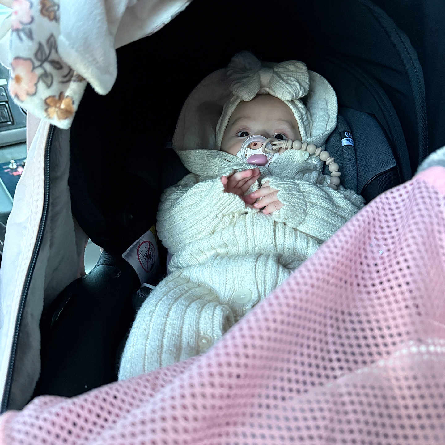 Asila joined the competition — help win amazing prizes! baby, beaded_clip, bow, car_interior, car_seat, child, cozy, cute, eyes, face, headband, infant, knitted_clothing, pacifier, pink_mesh, portrait, seatbelt, small_hands, warm_clothing, wrapped