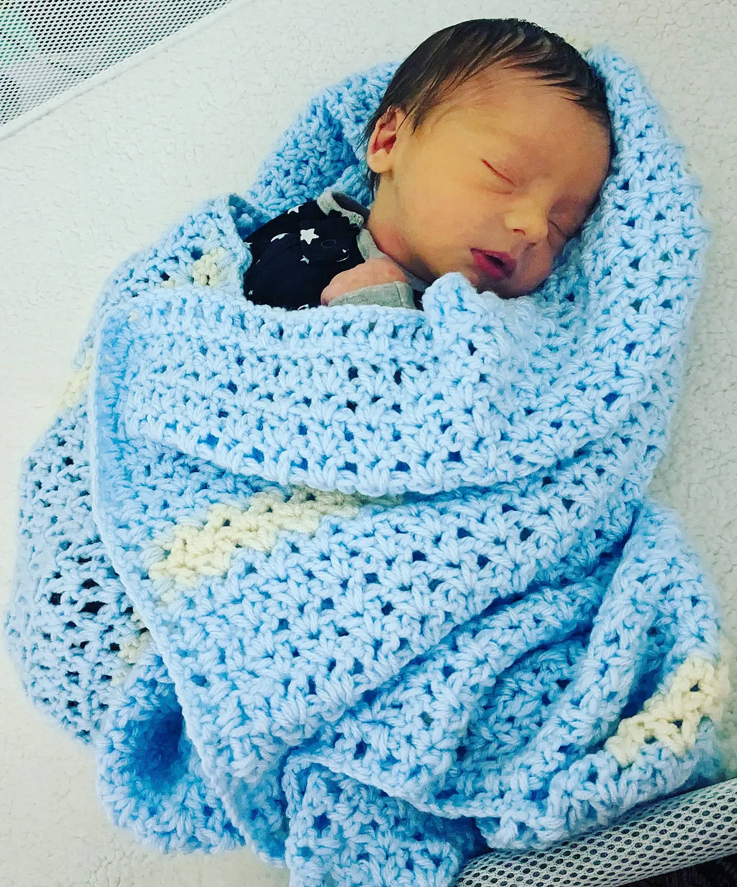 Grayson joined the competition — help win amazing prizes! baby, baby_products, baby_sleeping, baby_toddler_clothing, child, comfort, craft, creative_arts, electric_blue, knit_cap, linens, outerwear, pattern, person, sitting, sleeve, textile, toddler, wool, woolen