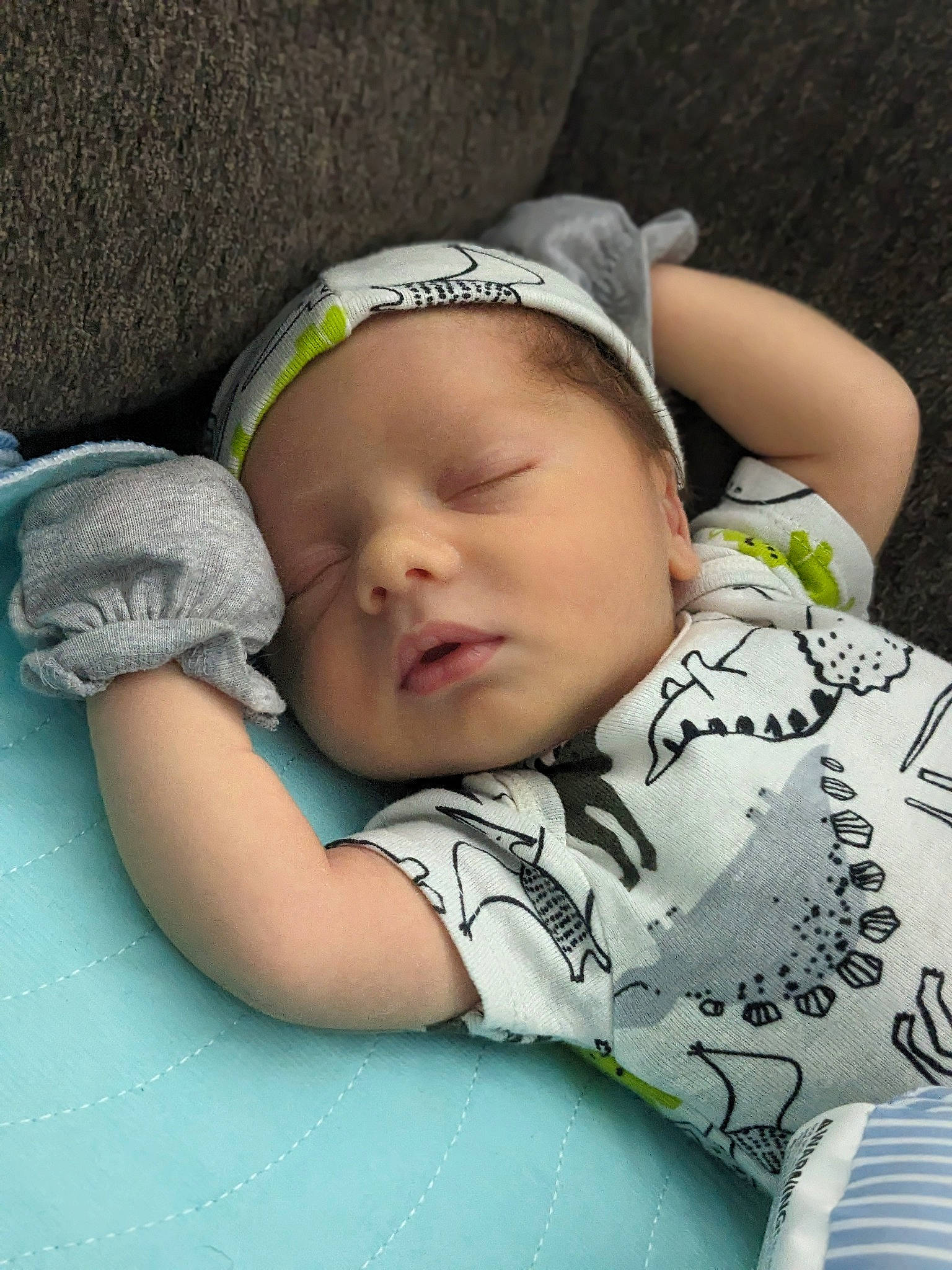 Grayson is registered to the contest to win money with this photo: baby, baby_products, baby_sleeping, baby_toddler_clothing, cap, cheek, child, comfort, eye, eyelash, finger, grass, happy, head, linens, mammal, person, sitting, skin, sleeve