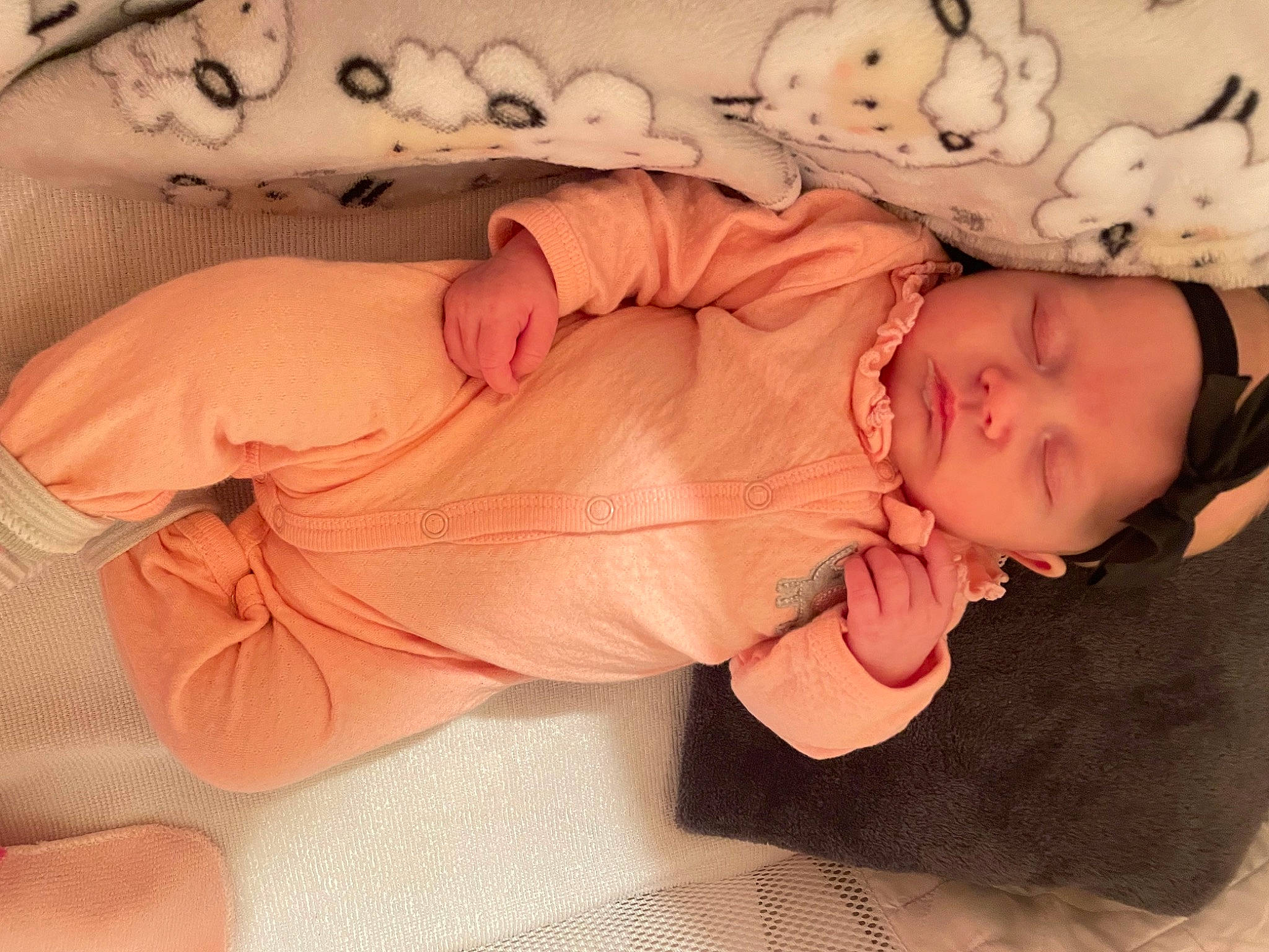 Kenzlee is registered to the contest to win money with this photo: arm, baby, baby_sleeping, baby_toddler_clothing, cheek, child, comfort, ear, eyelash, headgear, human_body, lip, mouth, nose, peach, person, pink, skin, sleeve, toddler