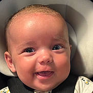 Cassidy is registered to the contest to win money with this photo: baby, car_seat, child, closeup, clothing, cute, expression, eyes, face, happy, harness, head, infant, mouth, person, portrait, seatbelt, skin, smiling, young_child