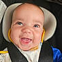 Cassidy joined the competition — help win amazing prizes! baby, bib, blue_eyes, car_seat, child, child_safety, closeup, clothing, colorful, cute, expression, face, happy, headrest, indoors, infant, portrait, safety_harness, seatbelt, smile