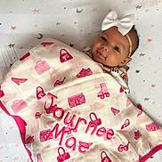 Journee joined the competition — help win amazing prizes! baby, blanket, crib, face, furniture, head, infantbed, person, quilt
