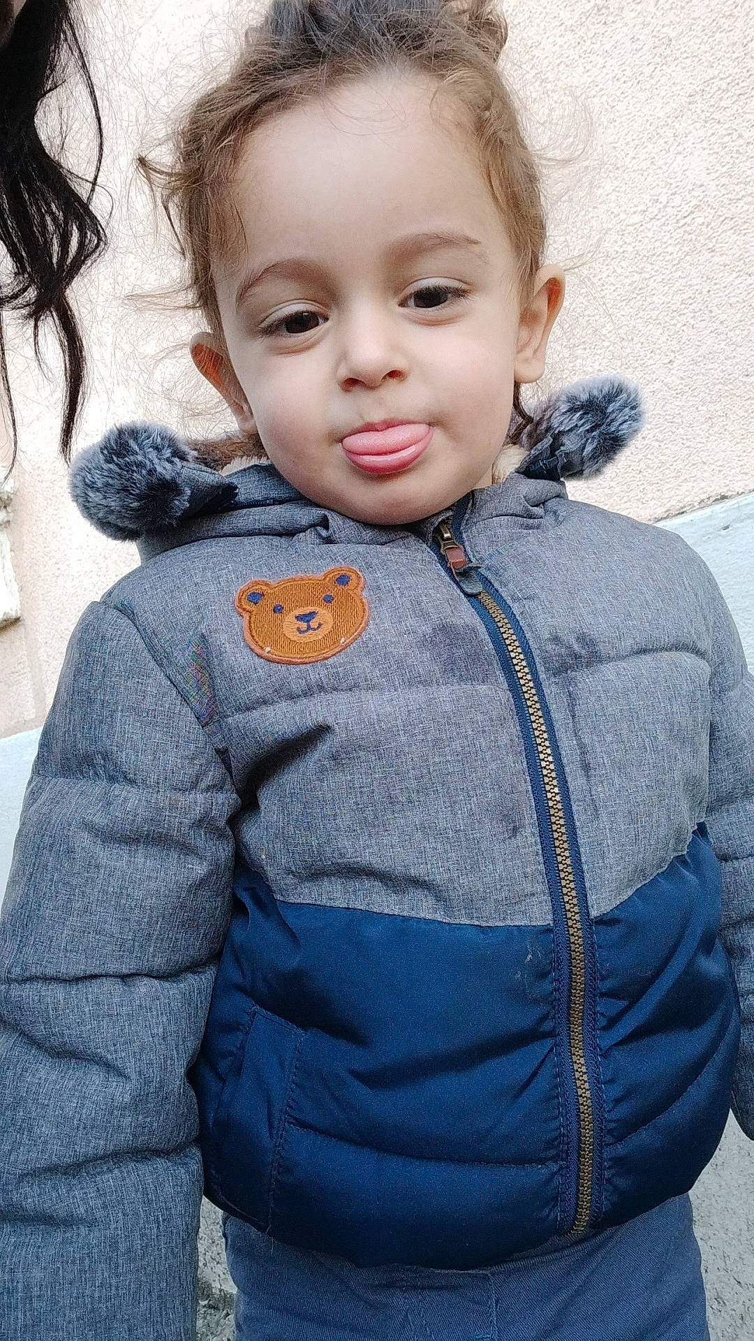 Aylan participe au concours pour gagner de l'argent avec cette photo : baby_toddler_clothing, button, child, doll, electric_blue, eye, fur, gesture, hair, happy, hood, iris, nose, outerwear, person, sitting, skin, sleeve, smile, toddler