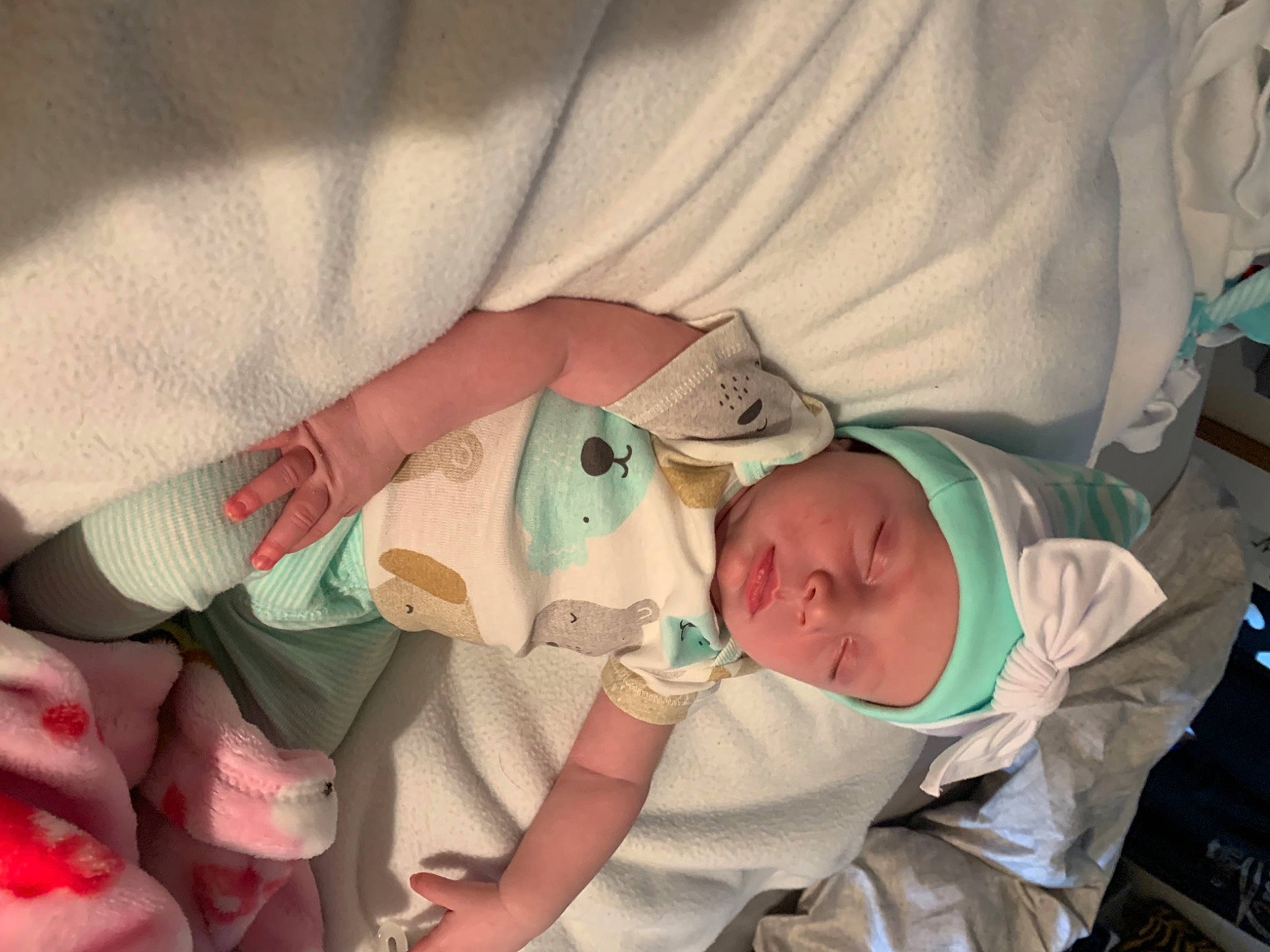 Charlie is registered to the contest to win money with this photo: arm, baby, baby_products, baby_safety, baby_toddler_clothing, cheek, child, comfort, face, finger, gesture, hand, head, headwear, human_body, linens, mouth, nail, person, skin