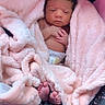 Keziah joined the competition — help win amazing prizes! newborn, baby, blanket, pink, car_seat, infant, wrapped, cute, sleepy, small, feet, hands, face, child, pattern, fabric, comfort, soft, resting, indoors