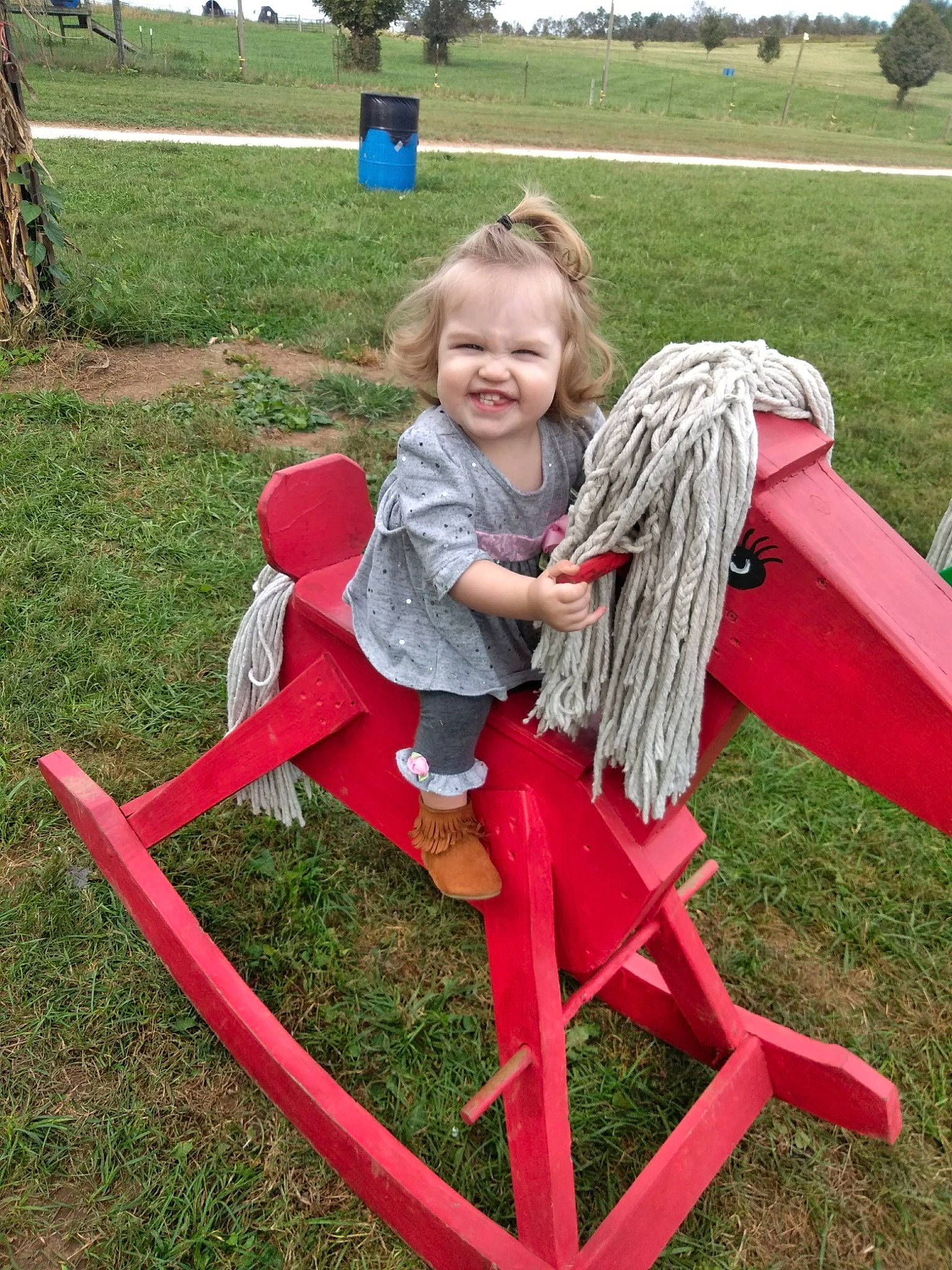Jade joined the competition — help win amazing prizes! backyard, child, fun, furniture, grass, human_settlement, joy, leisure, outdoor_play_equipment, person, play, playground, public_space, recreation, sitting, toddler
