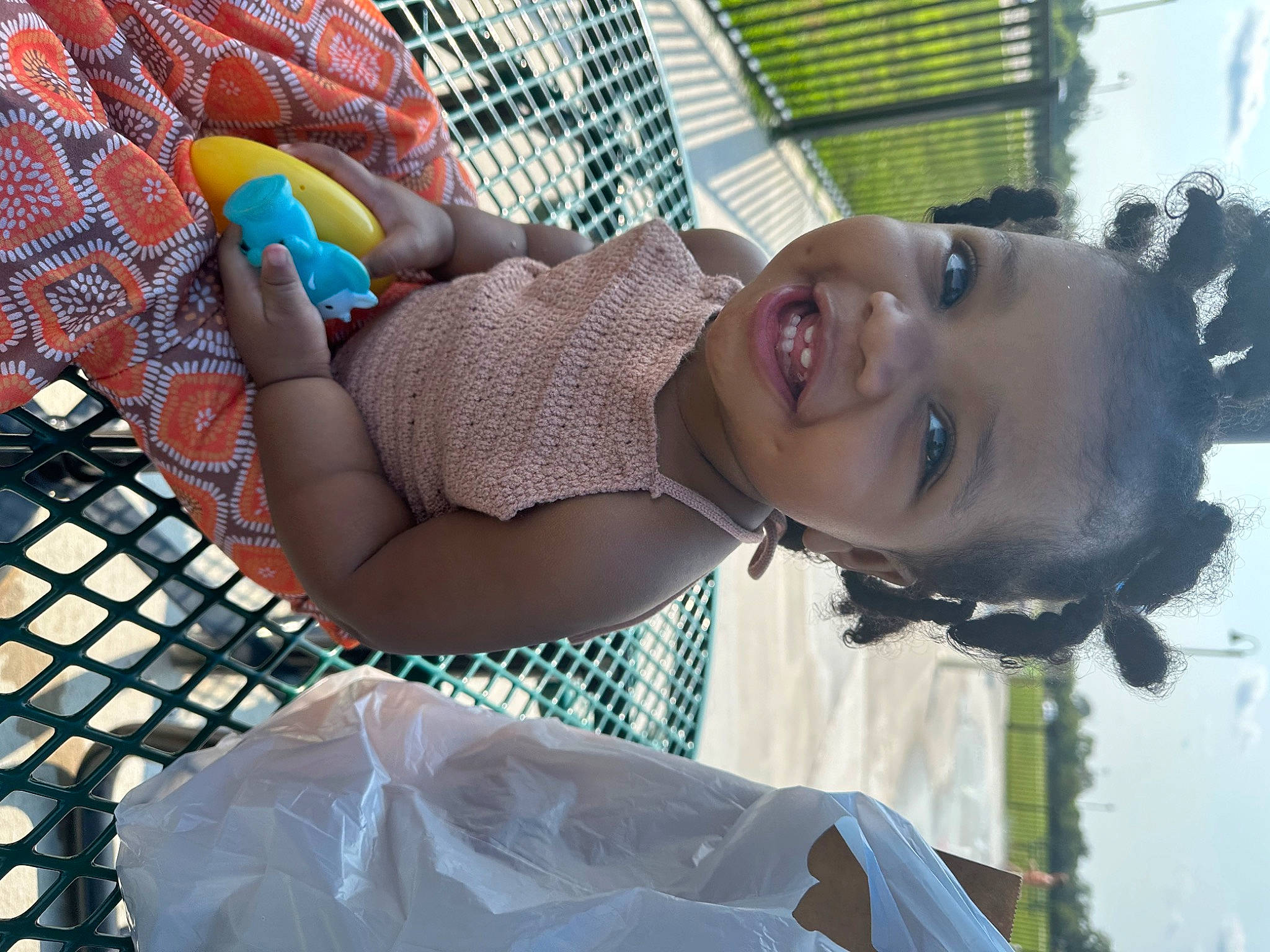 Aries is registered to the contest to win money with this photo: baby, child, fun, grass, happy, hat, human_leg, leisure, mesh, net, pattern, person, recreation, smile, thigh, toddler, vacation, water