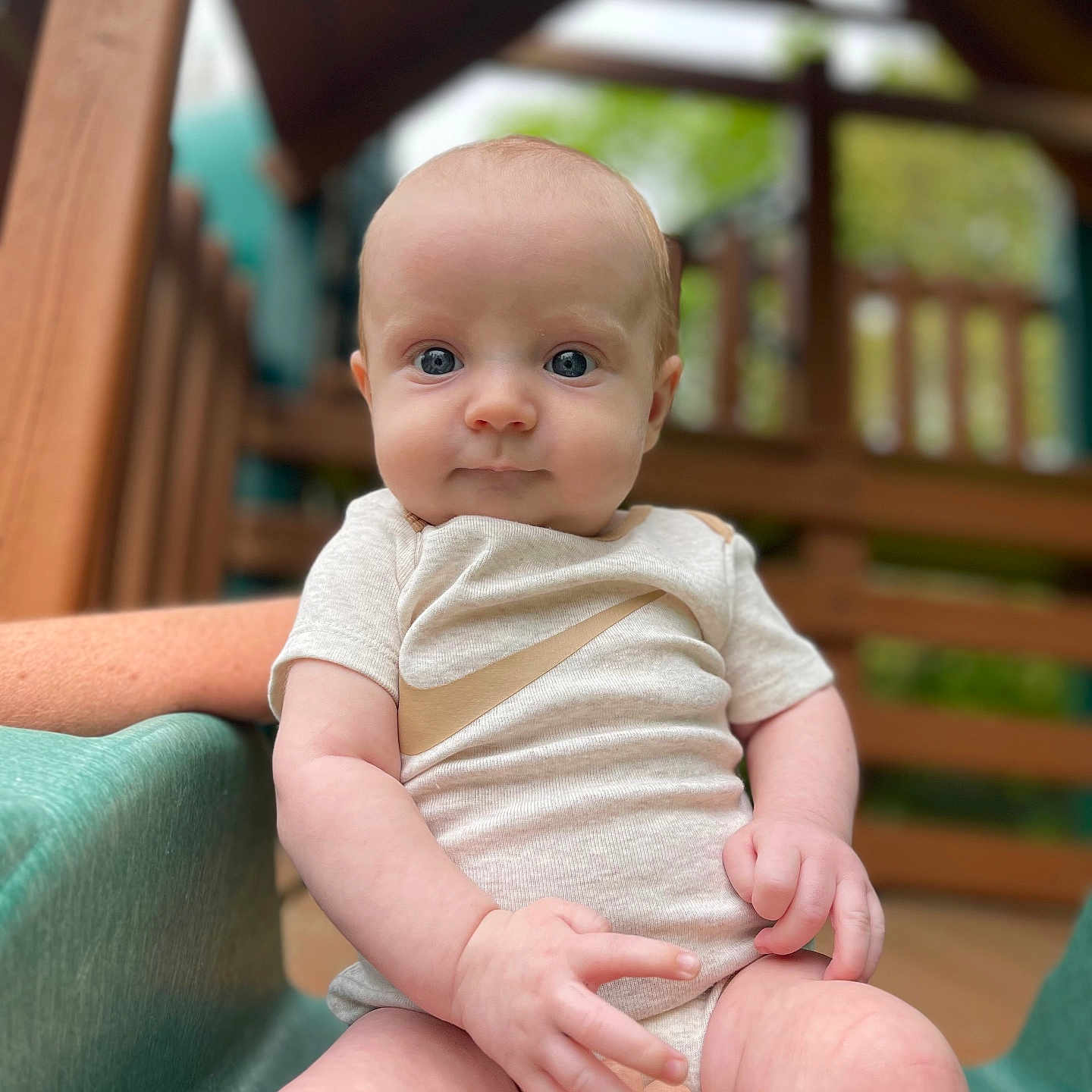 Kolton joined the competition — help win amazing prizes! baby, clothing, face, happy, head, newborn, outdoorplayarea, outdoors, pants, person, photography, plant, playarea, portrait, pottedplant, shorts, sitting, smile, t_shirt, toy
