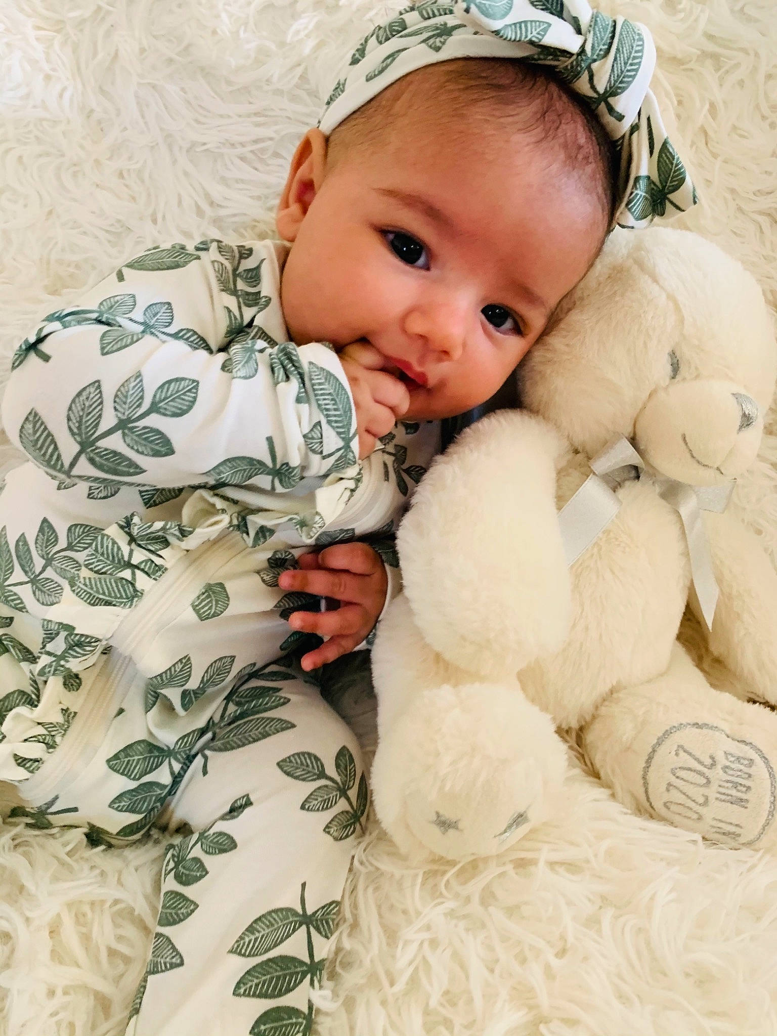 Alannah is registered to the contest to win money with this photo: baby, baby_products, baby_toddler_clothing, bonnet, camouflage, cheek, child, costume_accessory, ear, hair_accessory, headband, headpiece, human, military_camouflage, nose, person, plush, stuffed_toy, teddy_bear, toddler