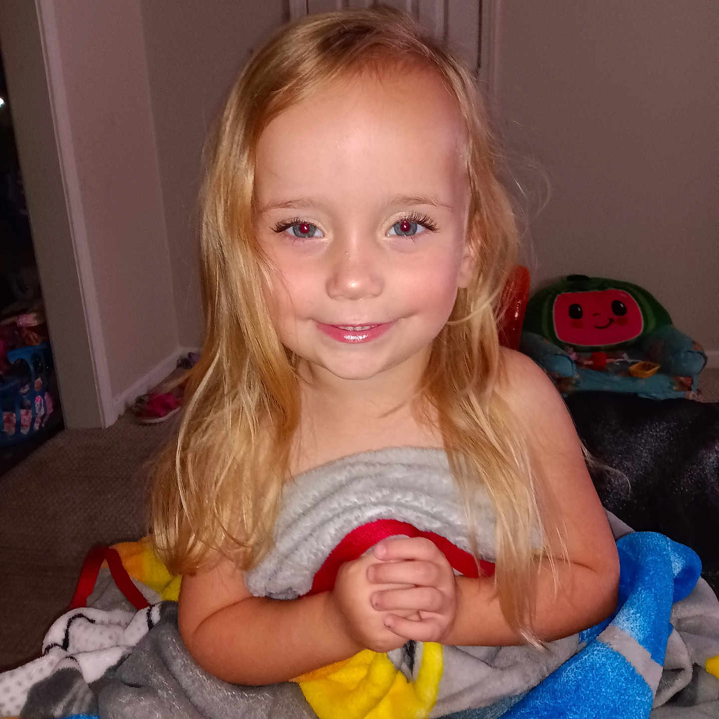 Emma is registered to the contest to win money with this photo: blanket, bodypart, child, couch, face, female, finger, furniture, girl, hand, happy, head, homedecor, laundry, person, photography, portrait, smile, towel, toy