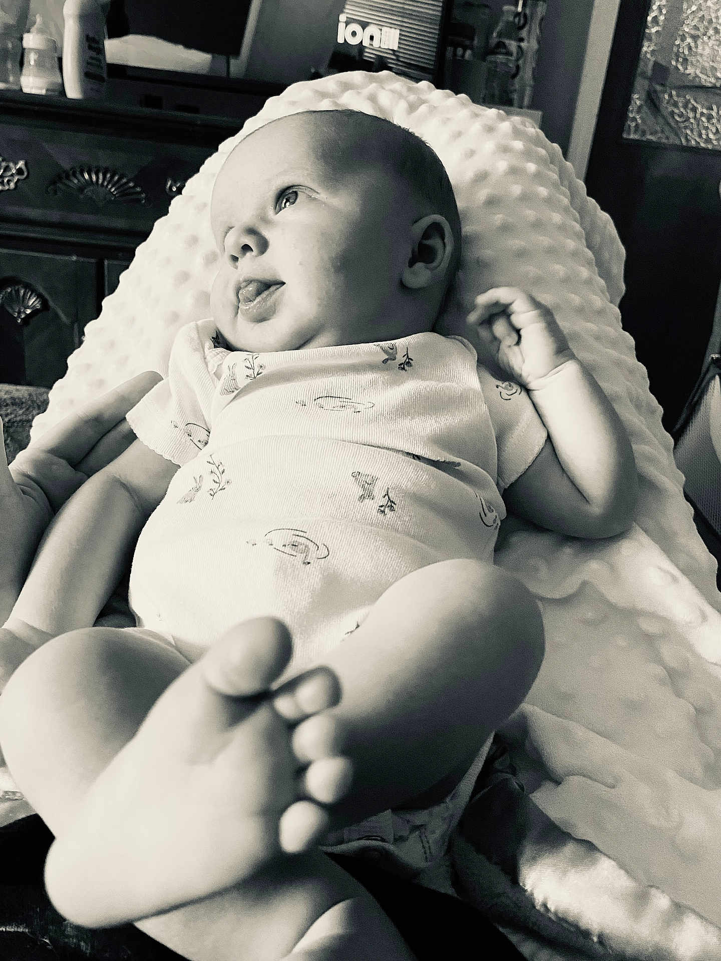 Luna is registered to the contest to win money with this photo: baby, infant, blanket, hand, face, feet, indoors, monochrome, texture, clothing, person, couch, expression, support, newborn, curious, portrait, soft, cozy, relaxing