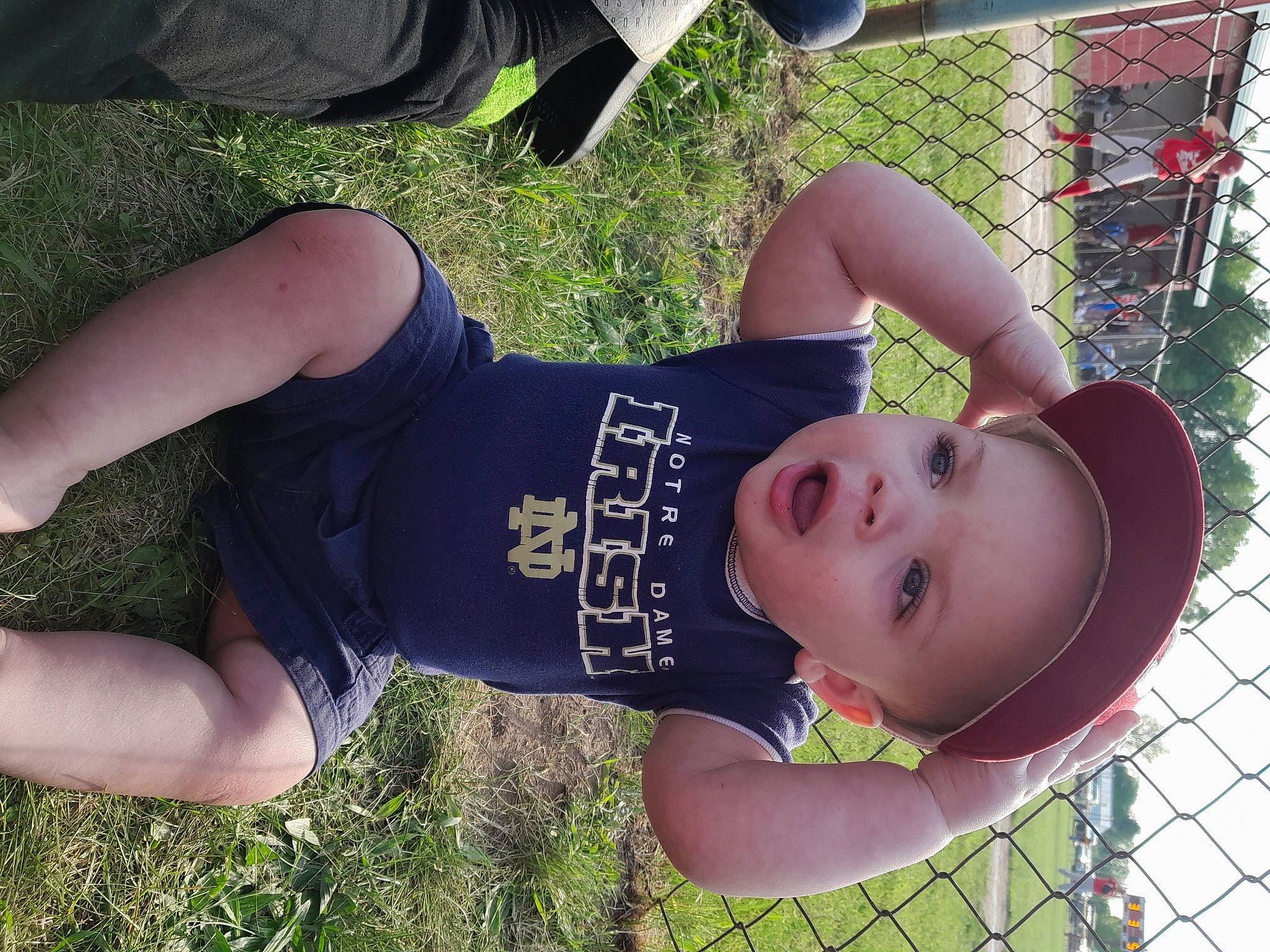 Kingston joined the competition — help win amazing prizes! baby_toddler_clothing, elbow, fence, fun, grass, green, happy, hat, headwear, human_leg, leisure, mesh, people_in_nature, person, plant, shorts, sleeve, smile, thigh, toddler