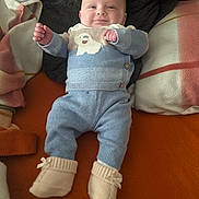 Eden participe au concours pour gagner de l'argent avec cette photo : baby, bodypart, clothing, couch, cushion, face, finger, footwear, furniture, hand, head, homedecor, hosiery, jeans, newborn, pants, person, photography, portrait, sock