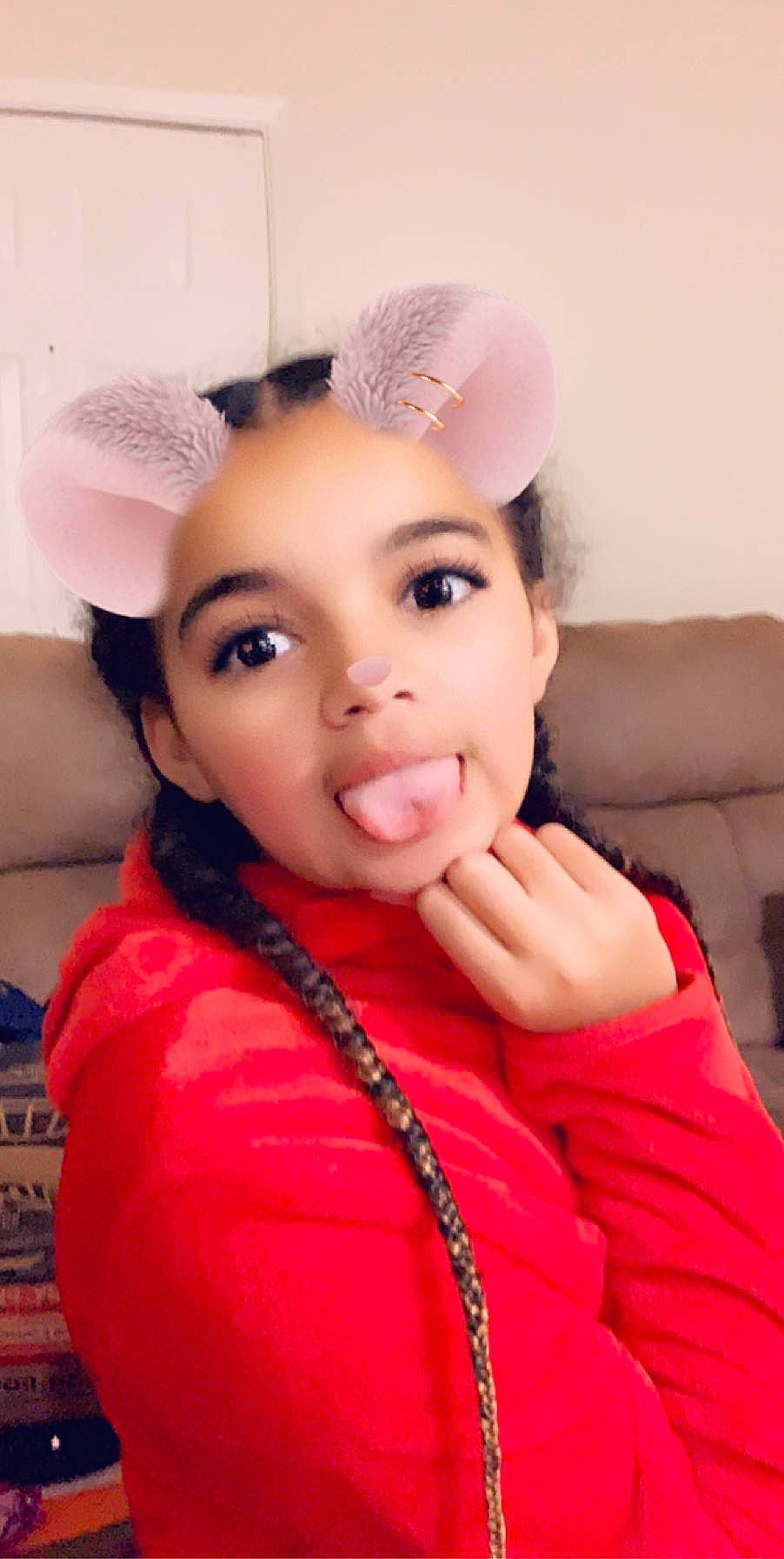 Aaliyah is registered to the contest to win money with this photo: audio_equipment, black_hair, cap, ear, eye, eyebrow, eyelash, flash_photography, gesture, happy, headband, headpiece, human_body, jaw, lip, magenta, nose, person, pink, skin