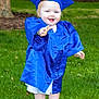 toddler, child, graduation_gown, blue_cap, grass, outdoor, smiling, celebration, happy, baby, feet, sandals, young_child, portrait, person, greenery, milestone, cute, summer, daylight