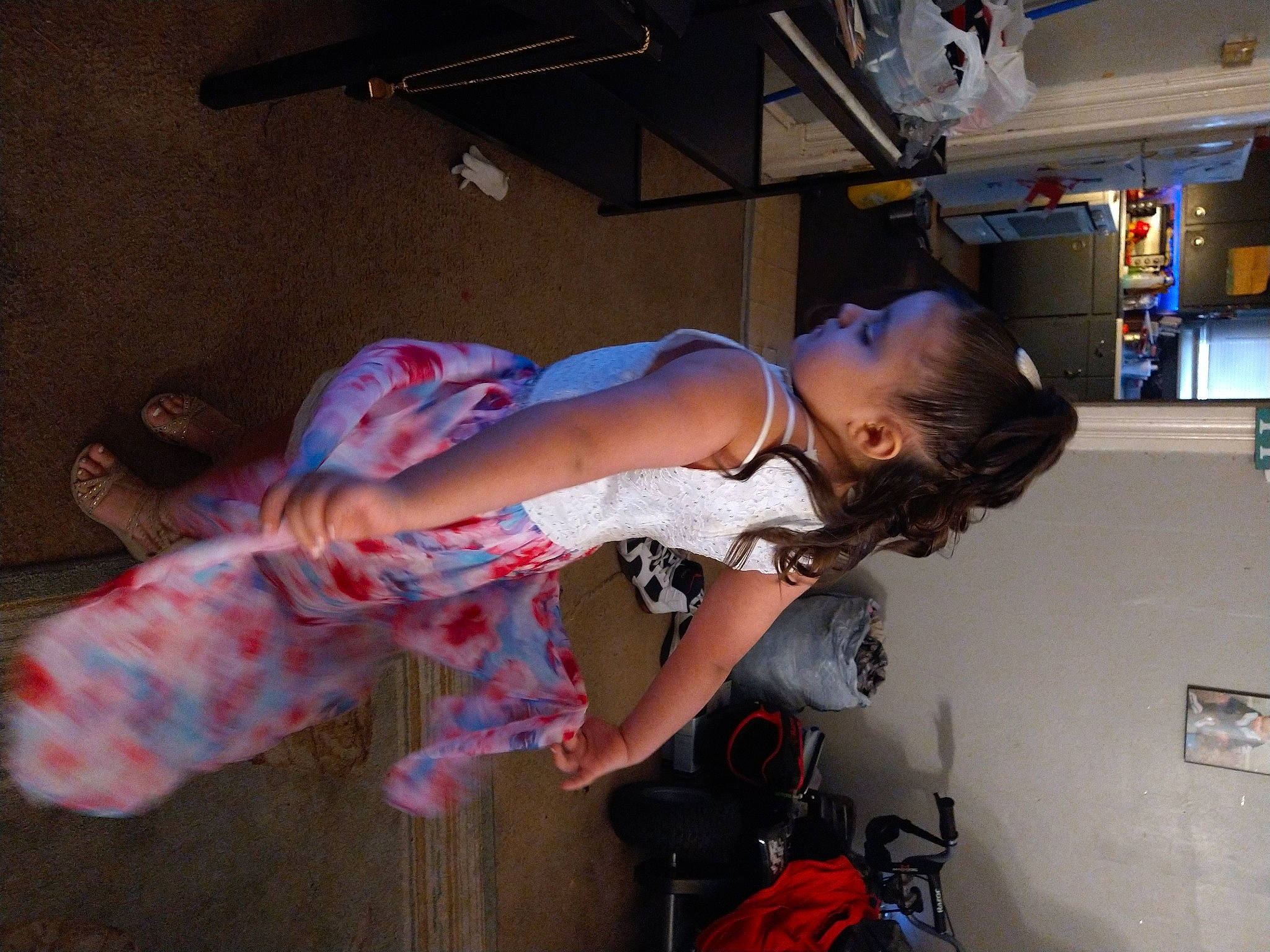 Alize is registered to the contest to win money with this photo: backpack, bag, chest, elbow, flesh, flooring, fun, hat, human_leg, knee, luggage_and_bags, machine, person, room, shelf, t_shirt, thigh, toddler, trunk