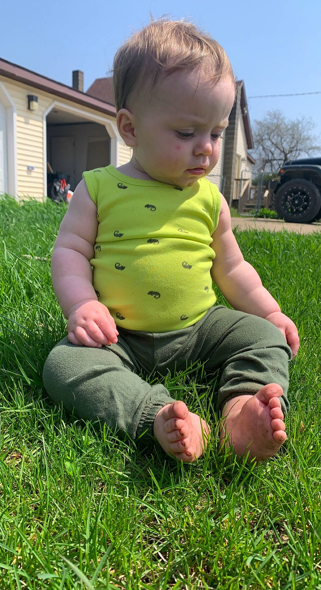 Henry joined the competition — help win amazing prizes! baby, baby_toddler_clothing, child, fun, grass, grass_family, grassland, green, happy, lawn, leisure, meadow, people_in_nature, person, plant, sitting, sky, tire, toddler, wheel