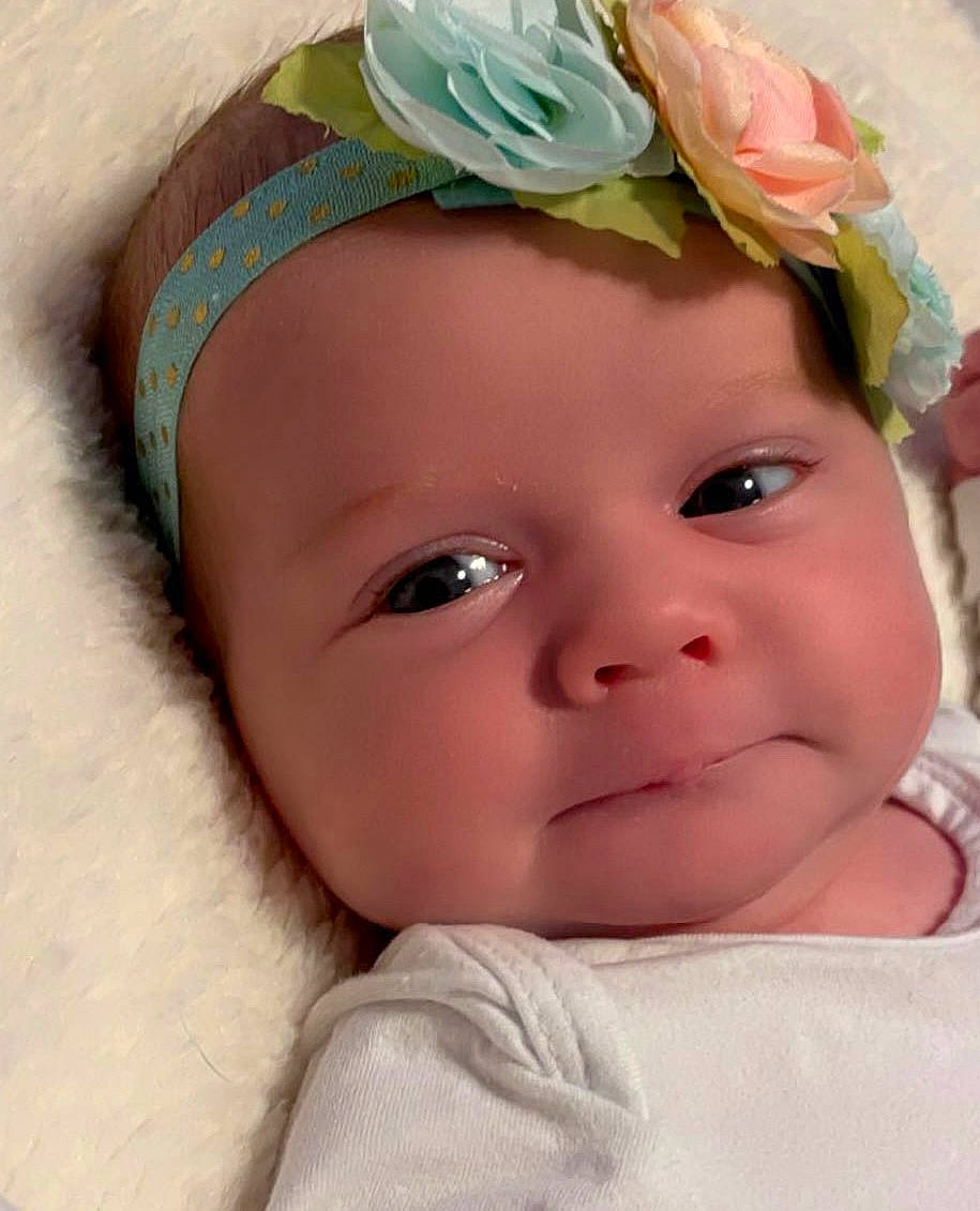 Shay joined the competition — help win amazing prizes! baby, baby_toddler_clothing, cheek, close_up, eye, eyelash, fashion_accessory, hair_accessory, happy, headband, headgear, headpiece, headwear, iris, lip, person, petal, pink, plant, skin