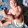 baby, back, blanket, bodypart, diaper, face, finger, hand, happy, head, newborn, person, photography, portrait, sitting, smile, toe, towel, toy, wrist