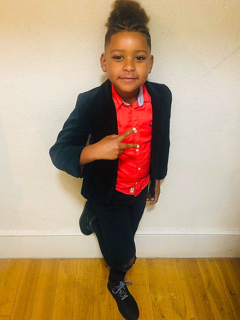 Yulian is registered to the contest to win money with this photo: black, blazer, child, footwear, fun, jacket, jeans, joy, knee, outerwear, person, shoe, standing, suit, t_shirt, toddler, top