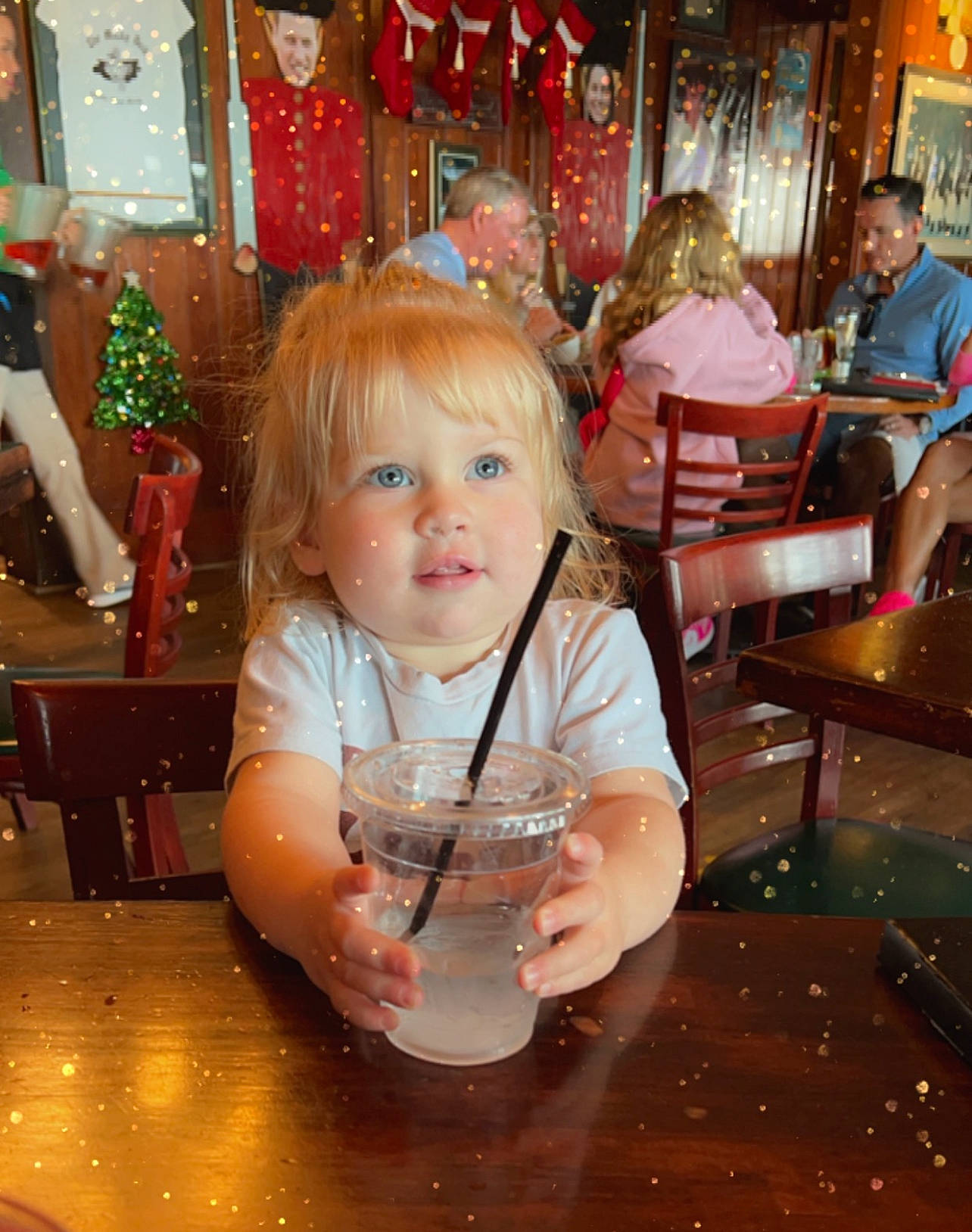 Emery joined the competition — help win amazing prizes! chair, child, drink, drinking, drinkware, event, flooring, fun, glass, head, holiday, leisure, person, room, sitting, soft_drink, t_shirt, table, tableware, toddler