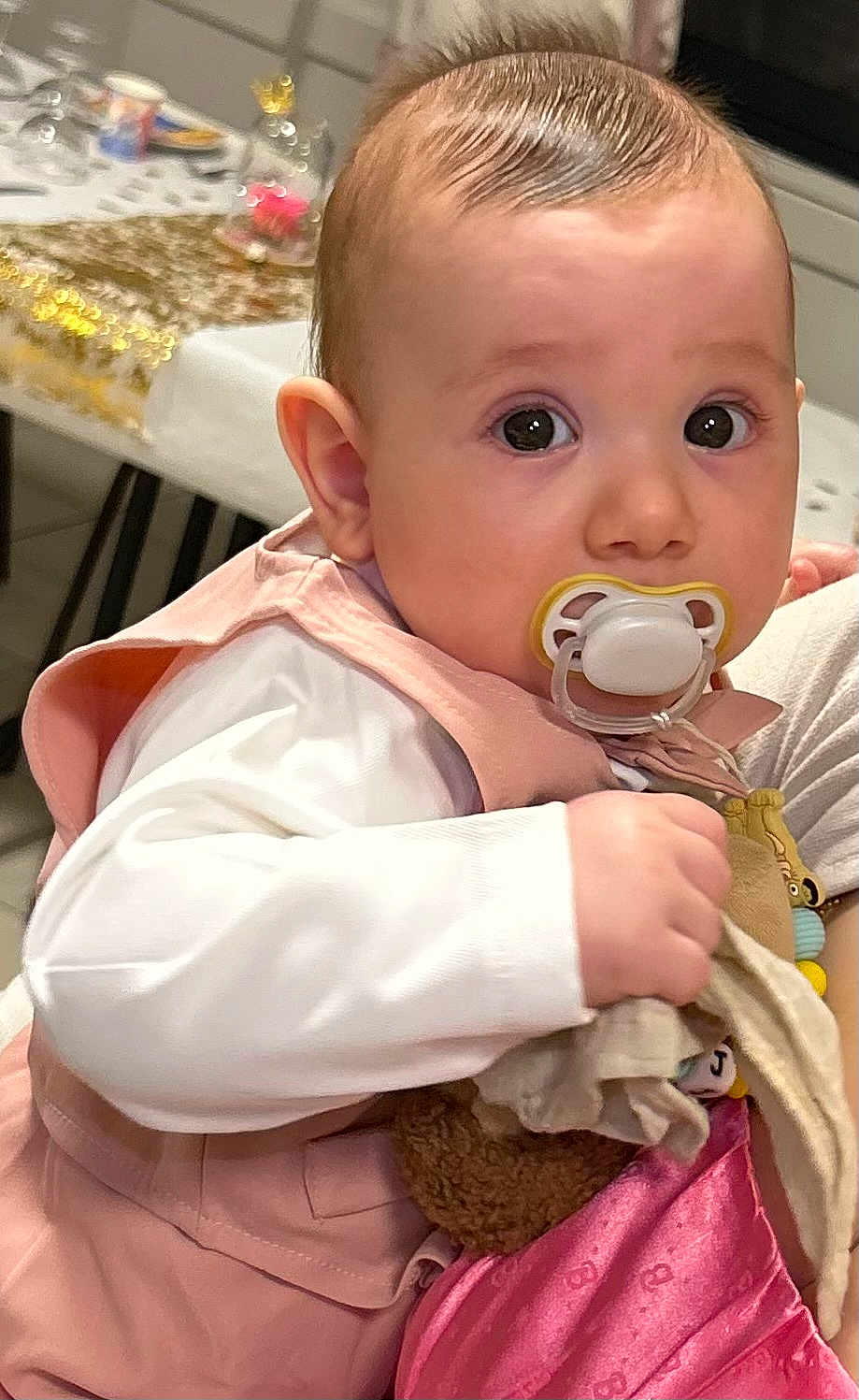 Elayijah participe au concours pour gagner de l'argent avec cette photo : baby, child, cloth, cute, decor, face, furniture, holding, indoor, infant, pacifier, person, pink_clothing, portrait, sitting, skin, soft_toy, table, wide_eyes, young_child