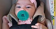 Bella joined the competition — help win amazing prizes! adorable, baby, car_safety, car_seat, child, closeup, cute, face, hand, headband, indoor, infant, infant_fashion, pacifier, pink_bow, pink_dress, portrait, safety, seatbelt, straps