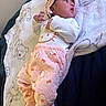 baby, blanket, child, clothing, cozy, cute, headband, hello_kitty, indoors, infant, lying_down, pajamas, person, pink, portrait, sleepwear, small_hands, soft_texture, teddy_bear_pattern, white