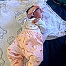 baby, baby_wipes, bed, blanket, child, clothing, cute, headband, hello_kitty, indoors, infant, newborn, pajamas, person, pink, resting, sleeping, soft, toddler, white
