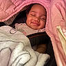 baby, blanket, car_seat, child, closeup, clothing, cozy, cute, face, happy, infant, pink_blanket, portrait, resting, sleepy, smiling, soft, toddler, warm, white_blanket