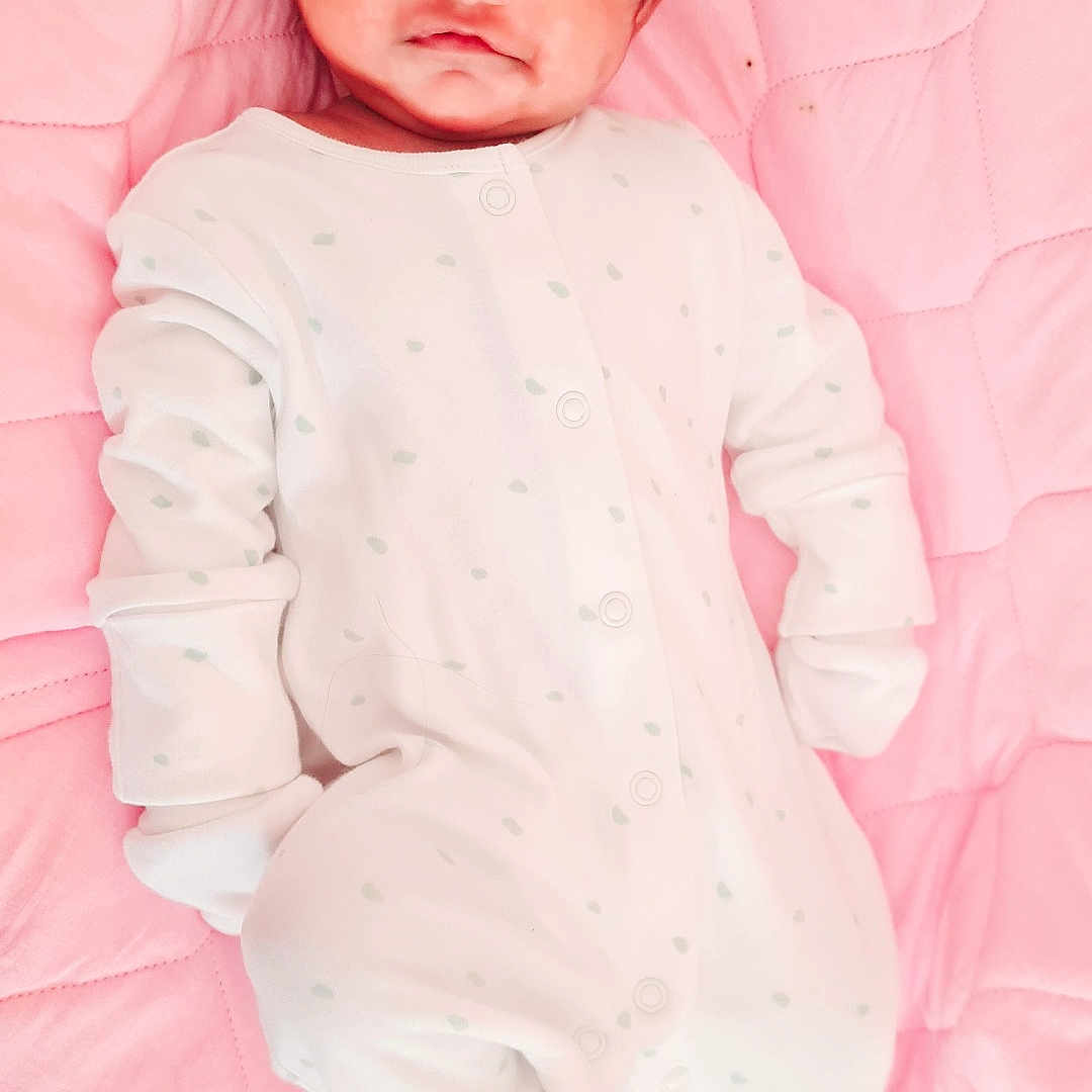 Joanna Marium Basil is registered to the contest to win money with this photo: baby, bed, blanket, bodypart, bonnet, cap, clothing, face, finger, furniture, happy, hat, head, hood, newborn, pajamas, person, photography, portrait, smile