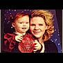 Nova is registered to the contest to win money with this photo: accessories, adult, baby, bodypart, earring, face, female, happy, head, jewelry, laughing, mouth, necklace, people, person, photography, portrait, smile, teeth, woman