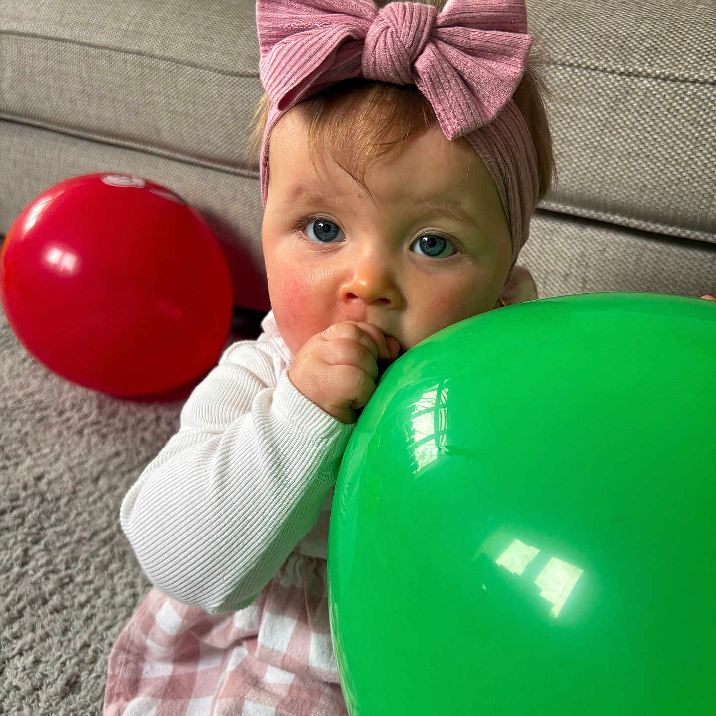 Willow-Anne joined the competition — help win amazing prizes! baby, balloon, blue_eyes, carpet, checkered_skirt, child, clothing, couch, cute, green_balloon, hand, headband, indoor, long_sleeve, pink_bow, portrait, red_balloon, sitting, toddler, young_child
